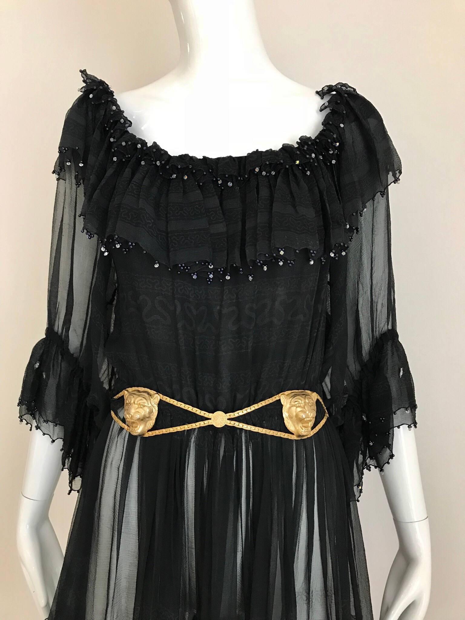 Late 70s Black Silk Zandra Rhodes off shoulder cocktail dress. elastic waist and elastic sleeve with ruffles. Belt is sold separately.
Fit size 4/6/8 Small to medium