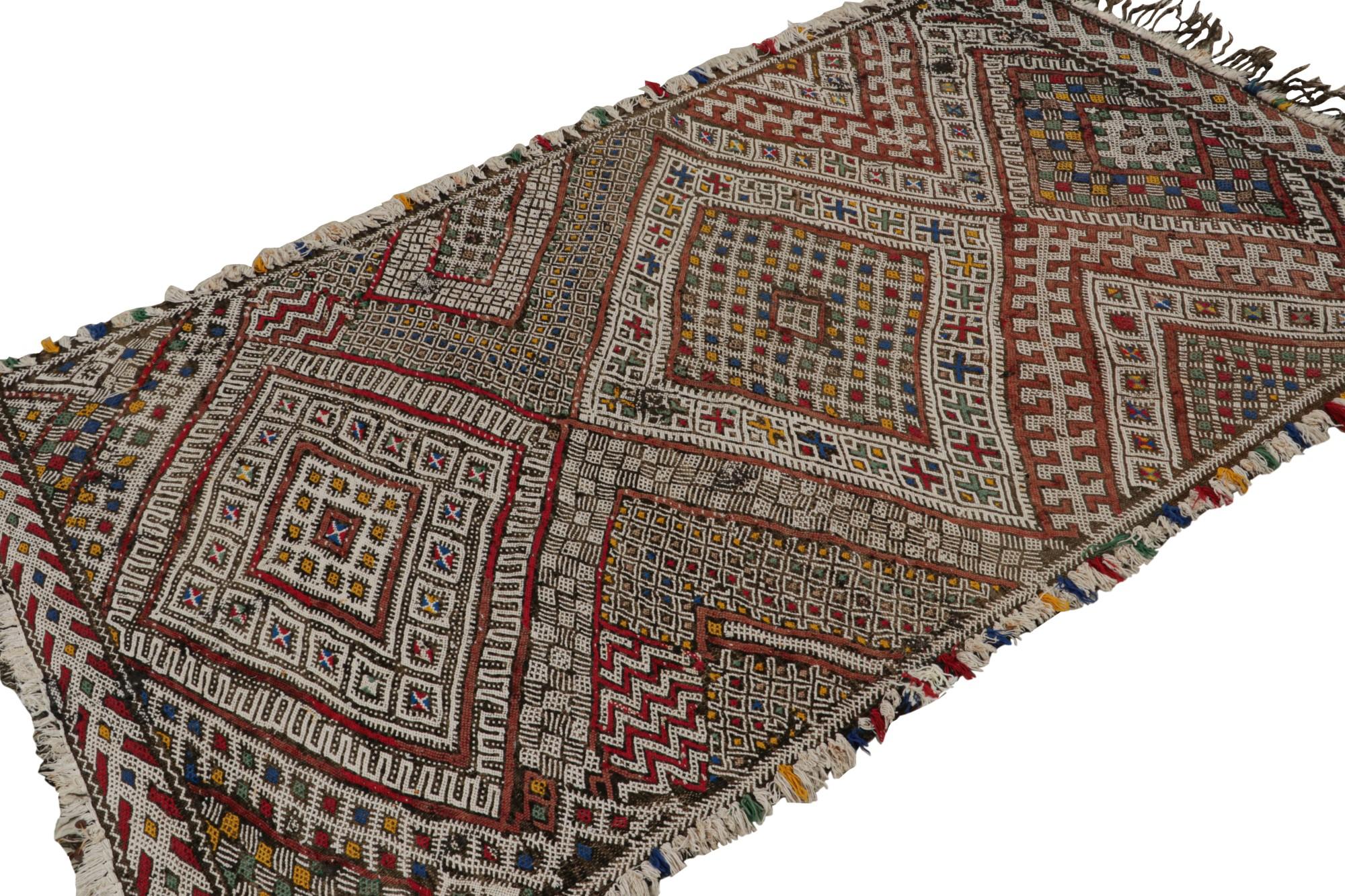 Hand-knotted in wool, this 4x6 vintage Zayane Moroccan kilim rug is believed to have originated from the same tribe in the middle Atlas mountain range in Morocco.  

On the Design: 

Admirers of the craft will appreciate this vintage rug as a