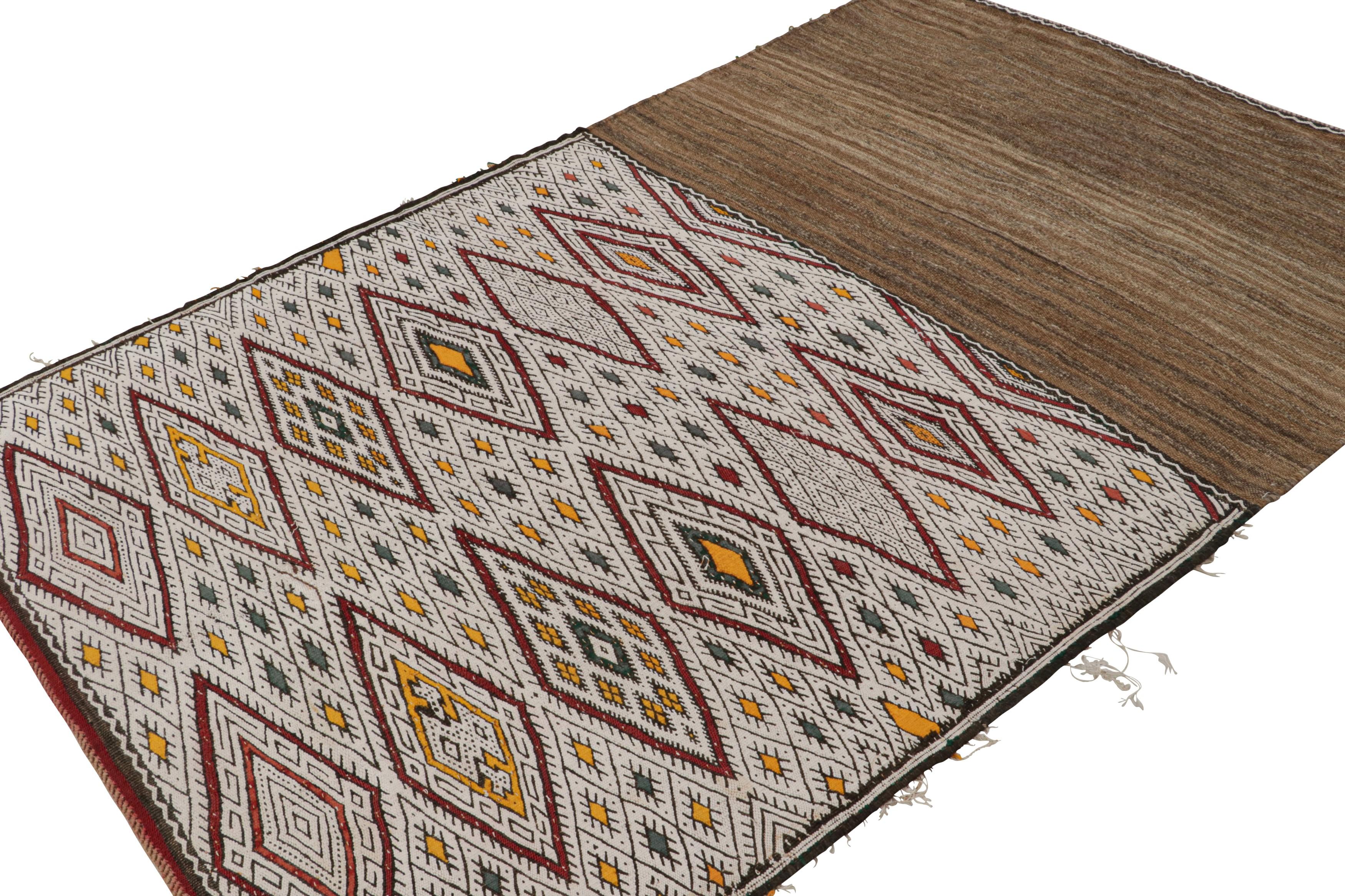 Handwoven in wool, a vintage 5x8 Zayane Moroccan Kilim - believed to originate from the Middle Atlas mountain range in Morocco.

On the Design:

This piece is particularly special for its similarity to tribal bags opened up from other cultures.