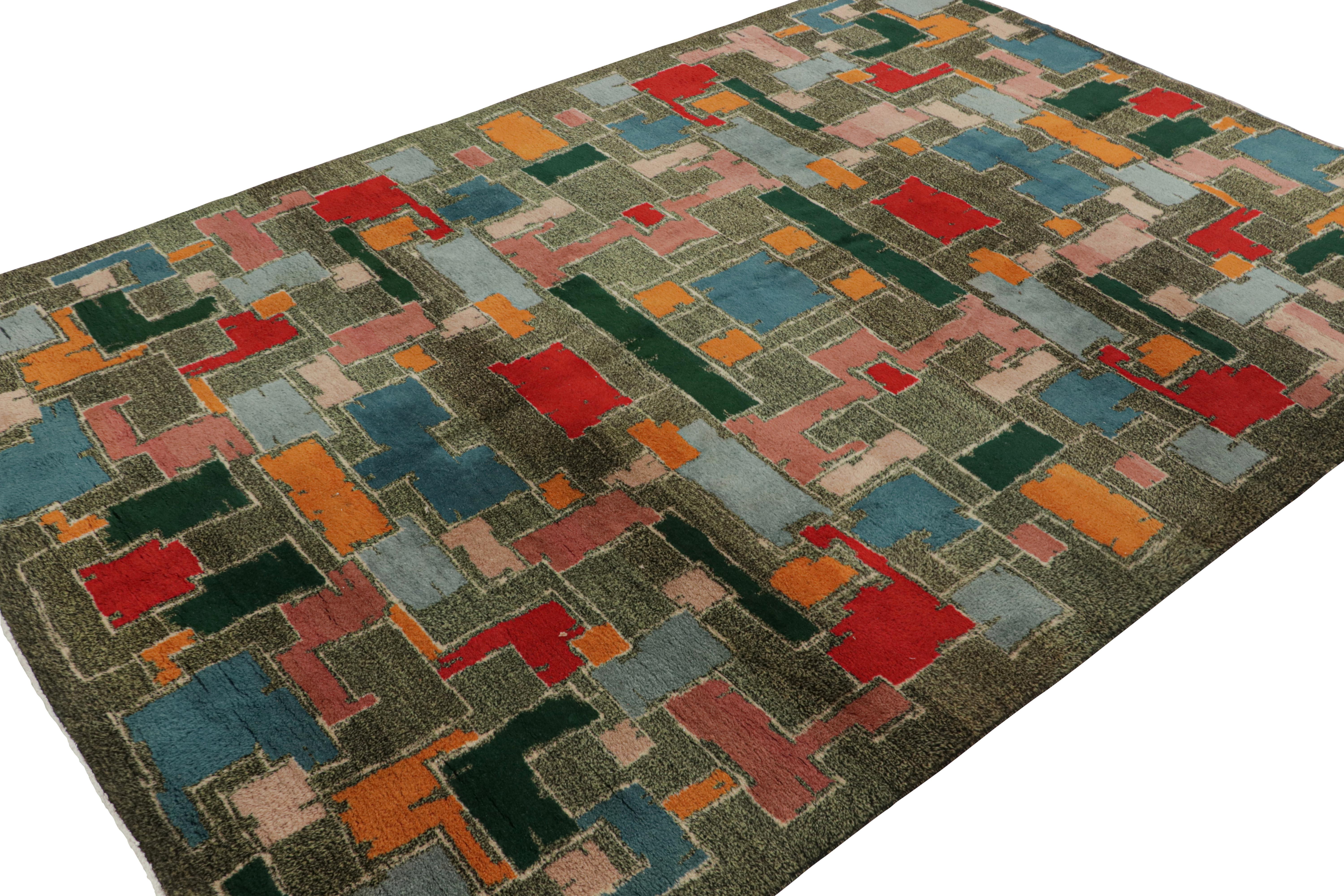 Hand-knotted in wool, circa 1960-1970, originating from Turkey, this 7x10 vintage rug is a classic Zeki Müren masterpiece. Its design with Art Deco-inspired geometric patterns, makes it an exciting addition to the Mid-Century Pasha Collection. 

On