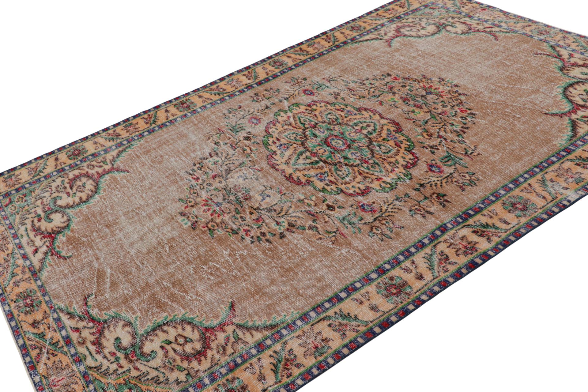This vintage 6x9 Zeki Müren European style rug, hand-knotted in wool, circa 1960-1970, has been inspired by Savonnerie, Aubusson, and even Persian rugs in some of its elements—interesting confluence of styles with subversive colors, all hallmarks of