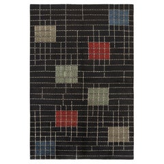 Alfombra vintage Zeki Müren negra con dibujo geométrico multicolor  Rug & Kilim