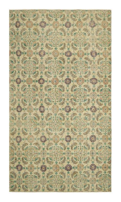 Alfombra vintage Zeki Müren en beige crema con motivos florales  Rug & Kilim