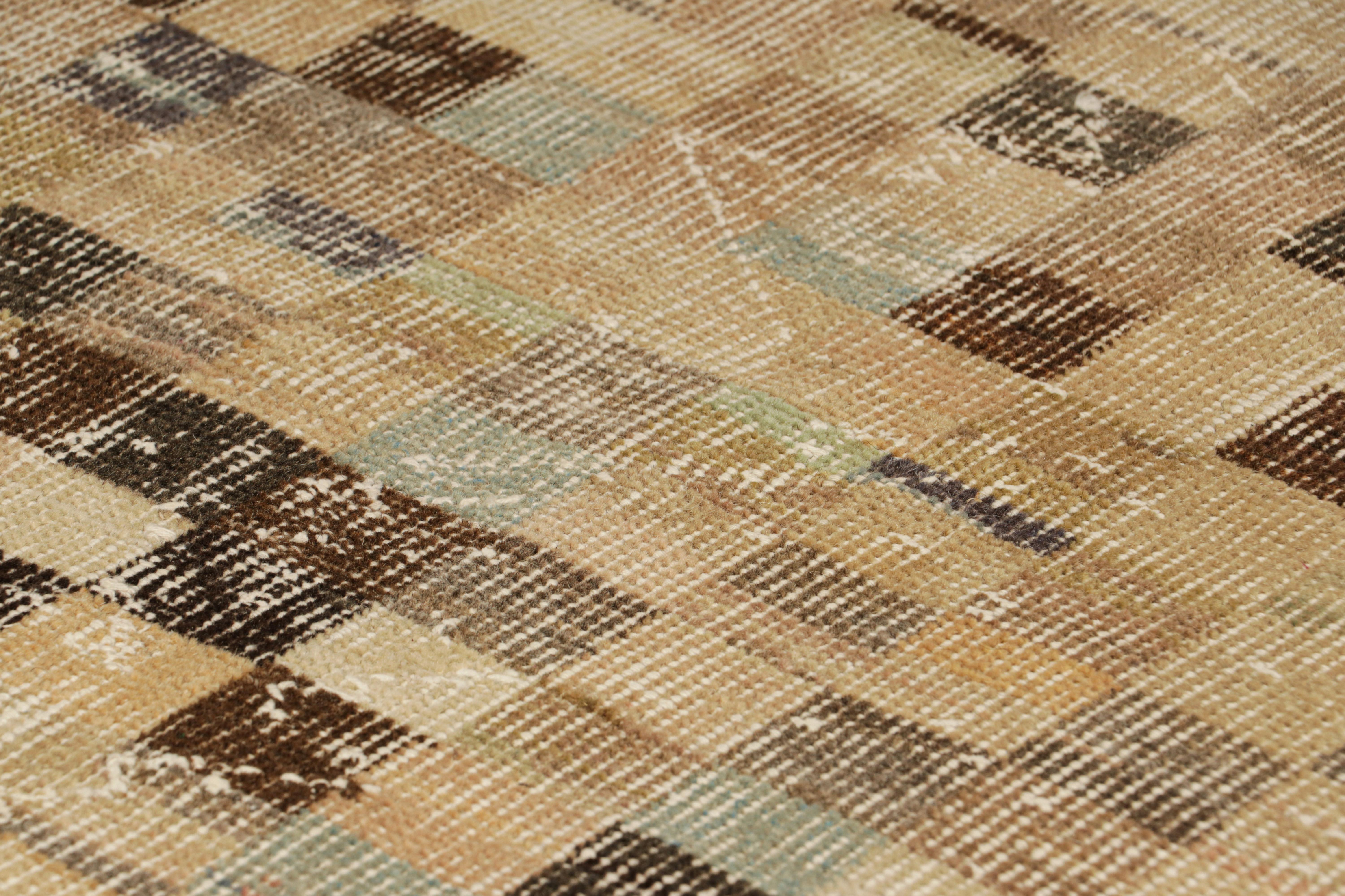 Hand-knotted in wool and originating from Turkey circa 1960 – 1970, this 3x5 vintage Zeki Müren rug is a unique addition to the Rug & Kilim Collection for its wide range of subtle colors and cubist geometric patterns across the field. 

On the