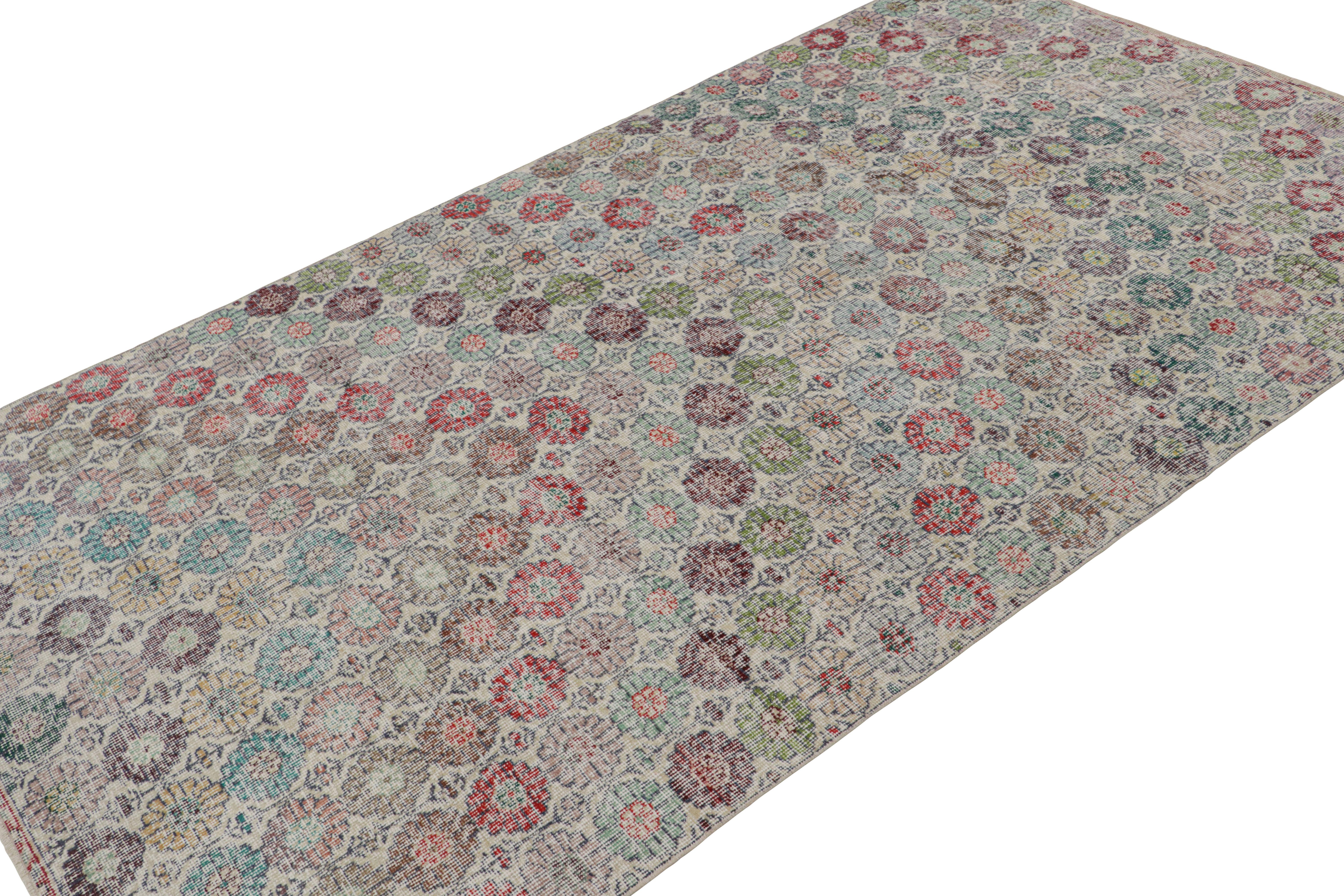 Handknotted in wool, this 5x8 vintage rug originates from Turkey, circa 1960-1970 and is believed to hail from the Turkish artist Zeki Muren. 

On the Design:

The rug features a beige field with cream undertones underscoring vibrant floral patterns