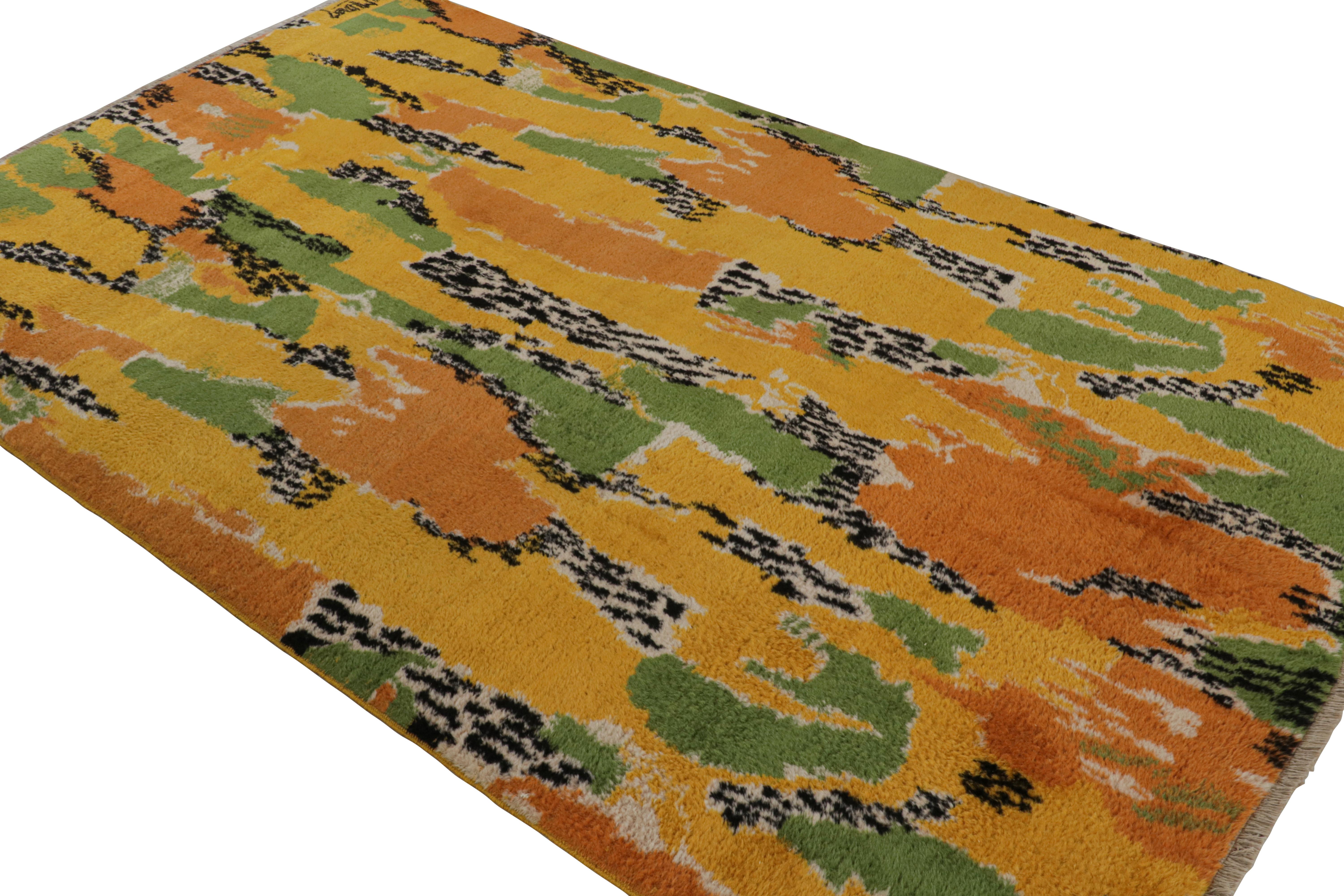 Hand-knotted in wool circa 1960-1970, this 5x9 vintage Art Deco rug is a rare signed piece by Zeki Müren. The artist’s signature is in the lower left corner, and a second signature reads “Leopar” in the upper left (Muren’s name for this series,