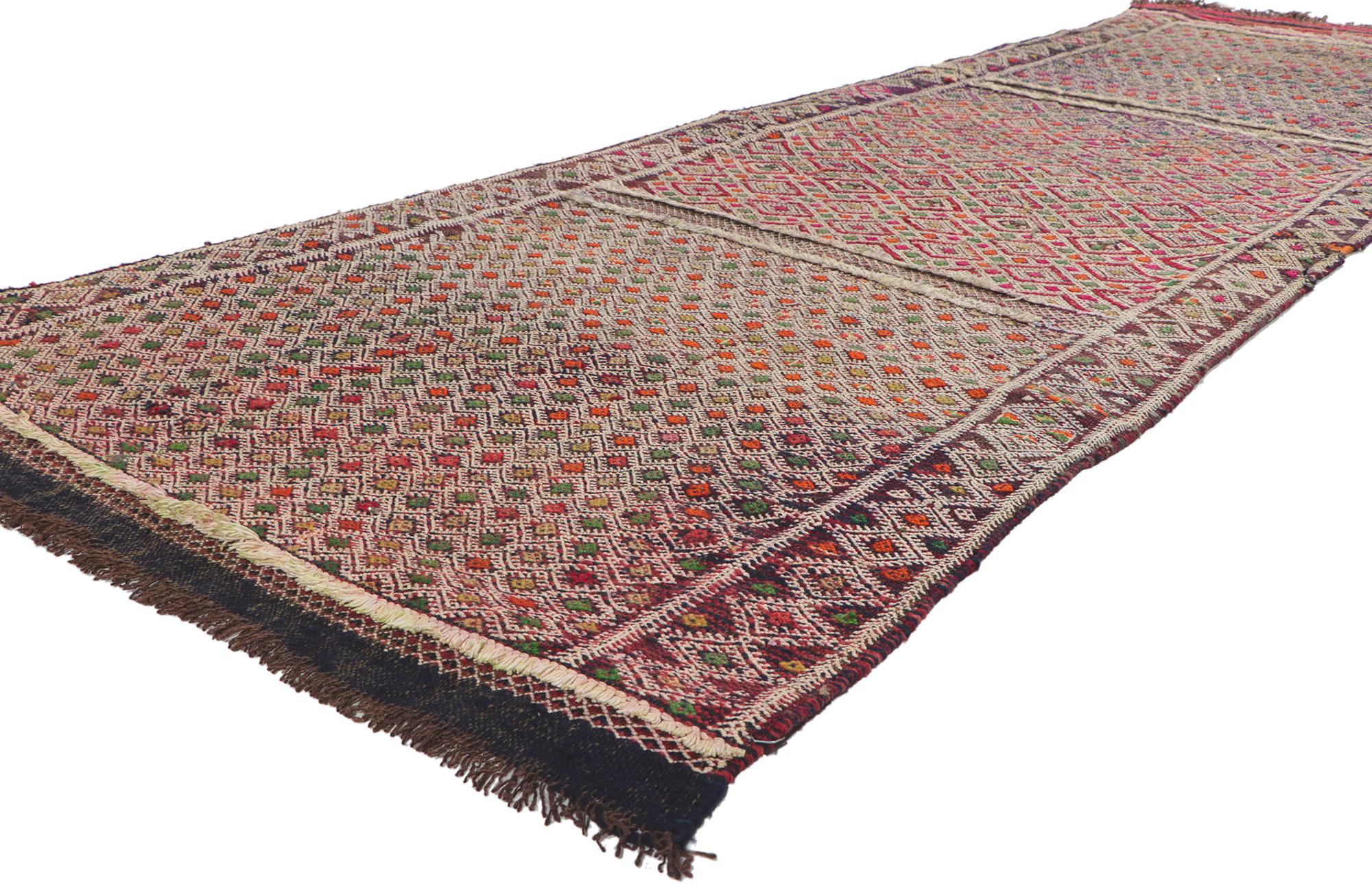 21716 Vintage Zemmour Moroccan Kilim runner, 03'03 x 09'02. Full of tiny details and tribal style, this hand-woven wool vintage Zemmour Berber Moroccan kilim rug runner is a captivating vision of woven beauty. The abrashed field is composed of