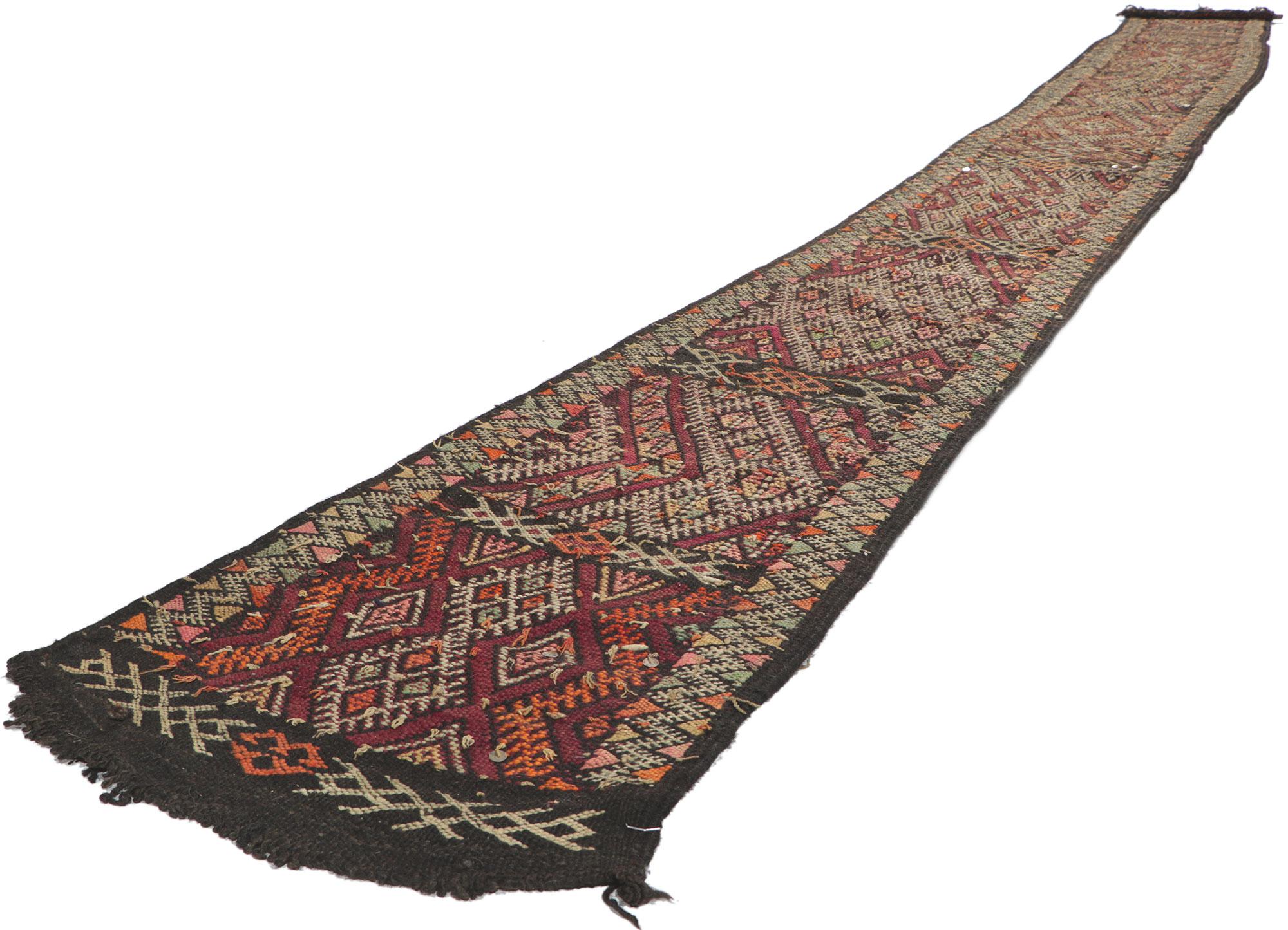 21715 Vintage Zemmour Moroccan Kilim runner, 01'07 x 16'00. Full of tiny details and tribal style, this hand-woven wool vintage Zemmour Berber Moroccan kilim rug runner is a captivating vision of woven beauty. The abrashed field is composed of