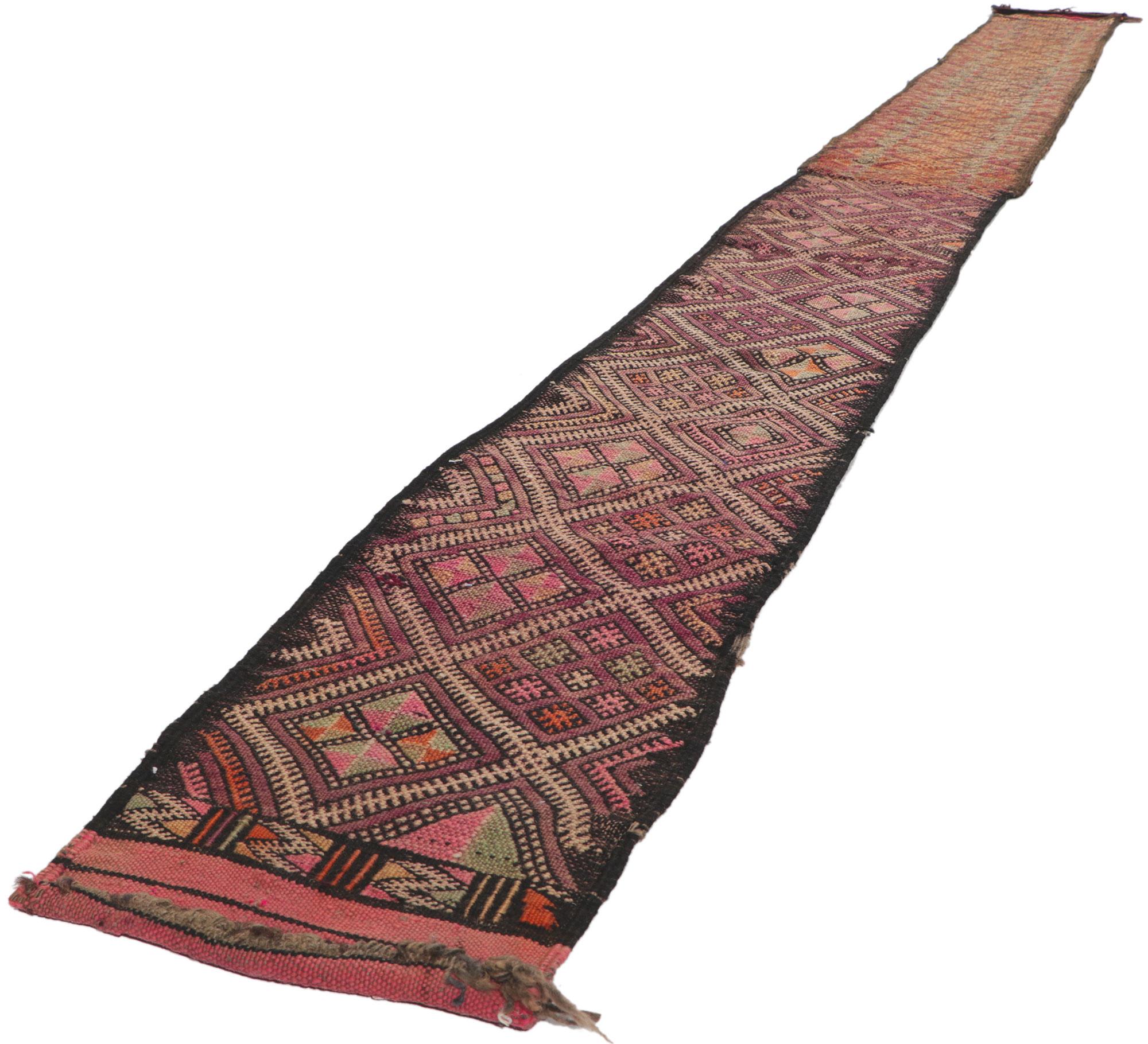 21714 Vintage Zemmour Moroccan Kilim Runner, 01'03 x 16'01. Full of tiny details and tribal style, this hand-woven wool vintage Zemmour Berber Moroccan kilim rug runner is a captivating vision of woven beauty. The abrashed field is composed of