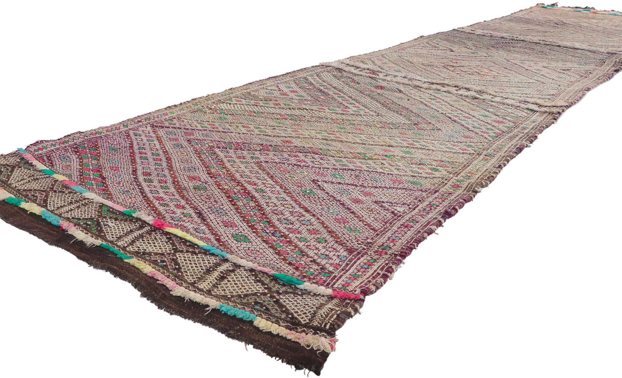 21713 Vintage Zemmour Moroccan Kilim Runner, 03'03 x 14'03. Full of tiny details and tribal style, this hand-woven wool vintage Zemmour Berber Moroccan kilim rug runner is a captivating vision of woven beauty. The abrashed field is composed of