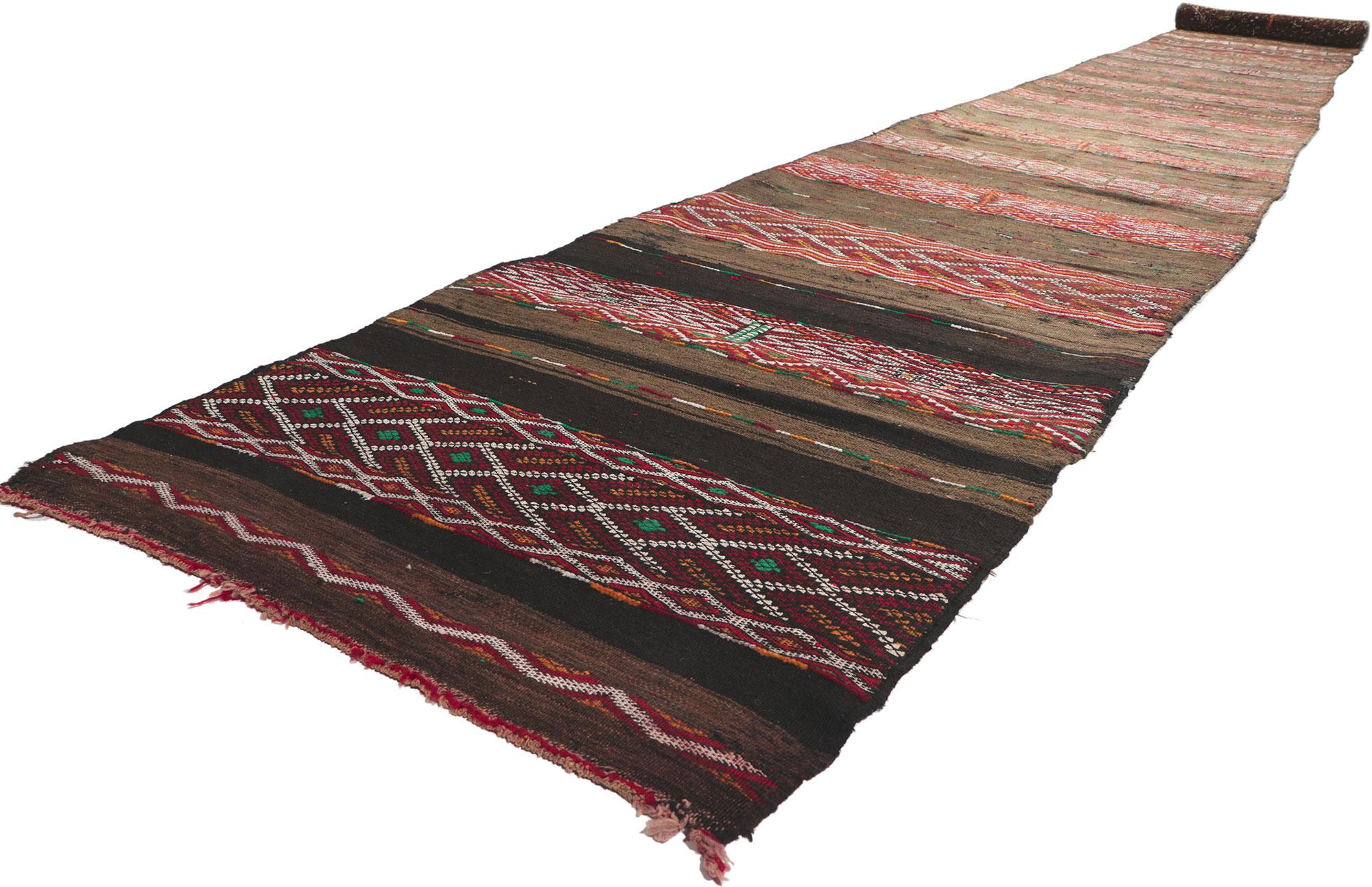 21718 Vintage Zemmour Moroccan Kilim runner, 03'03 x 35'00. Full of tiny details and tribal style, this hand-woven wool vintage Zemmour Berber Moroccan kilim rug runner is a captivating vision of woven beauty. The abrashed field is composed of