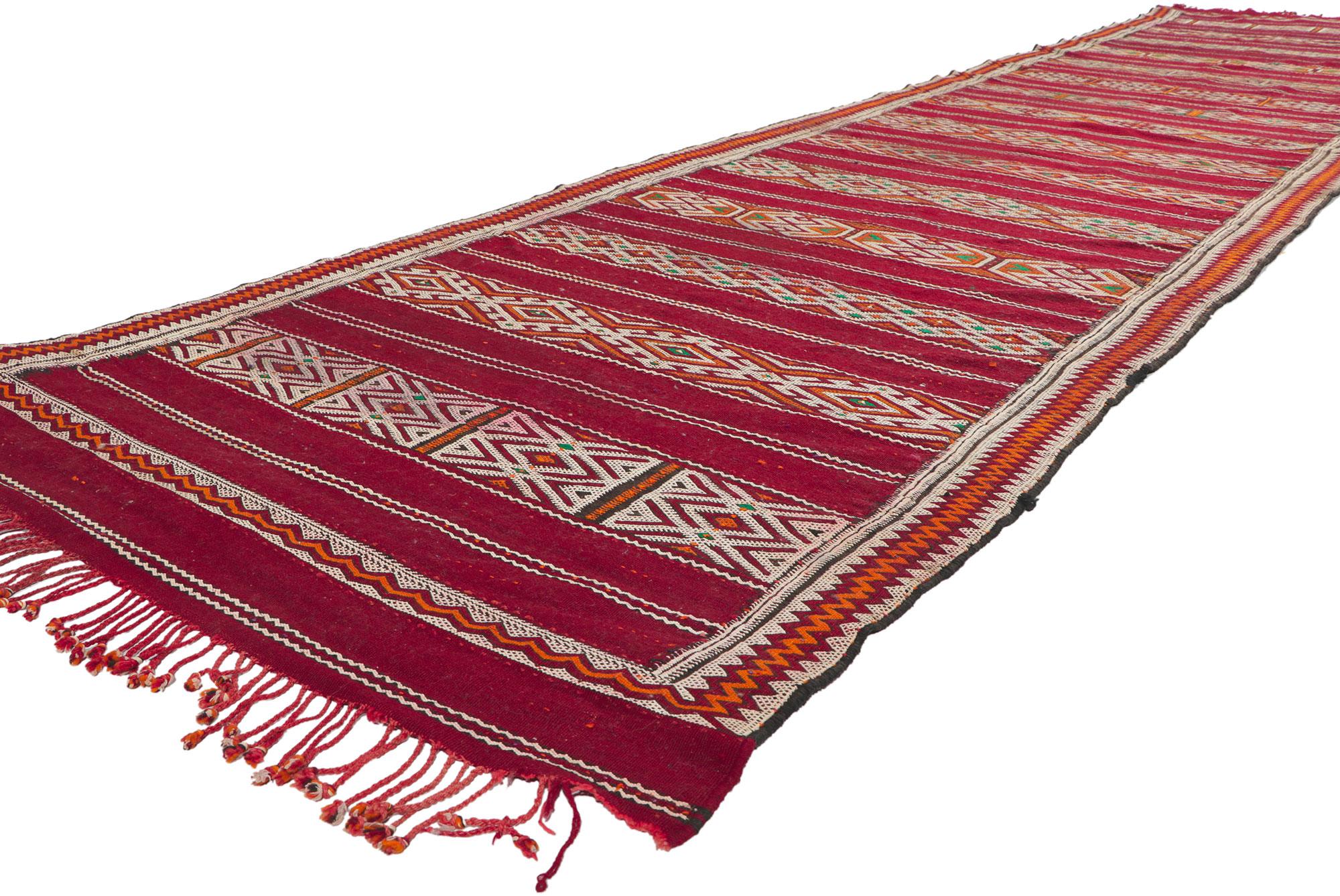 21707 Vintage Zemmour Moroccan Kilim runner, 03'08 x 16'04. Full of tiny details and tribal style, this hand-woven wool vintage Zemmour Berber Moroccan kilim rug runner is a captivating vision of woven beauty. The abrashed field is composed of