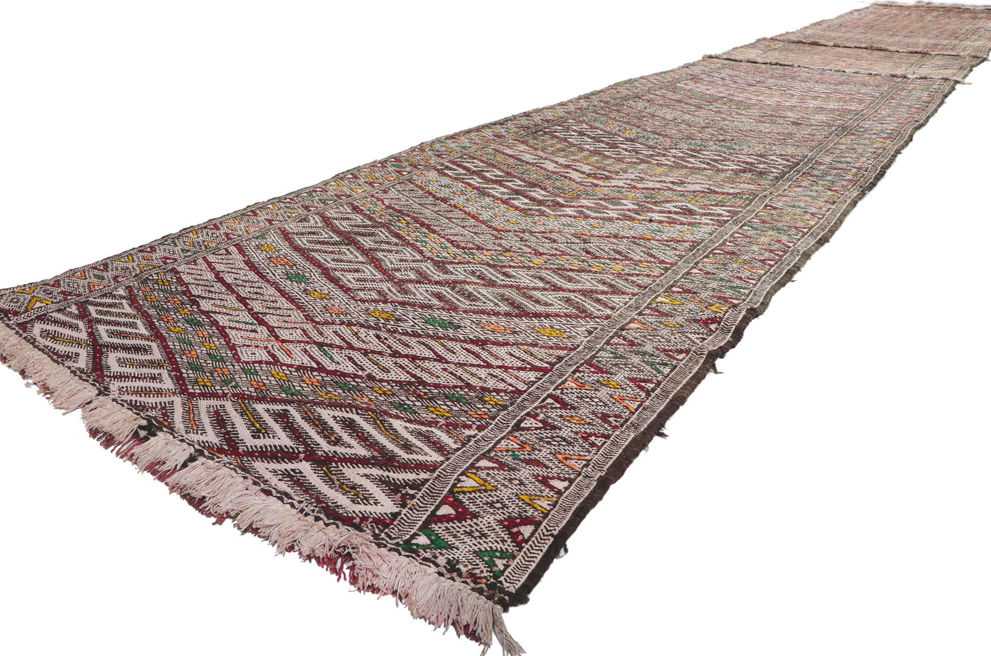 21705 Vintage Zemmour Moroccan Kilim Runner, 03'08 x 24'03. Full of tiny details and tribal style, this hand-woven wool vintage Zemmour Berber Moroccan kilim rug runner is a captivating vision of woven beauty. The abrashed field is composed of