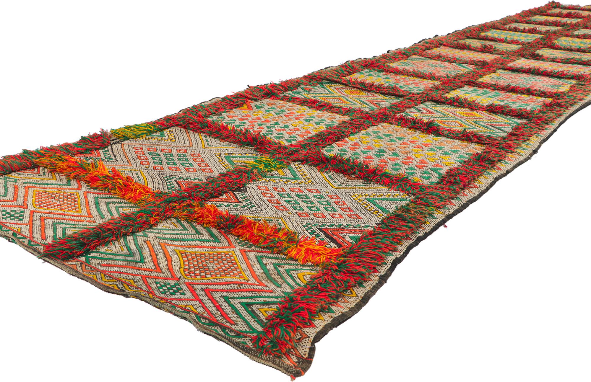 21708 Vintage Zemmour Moroccan Kilim Runner, 03'02 x 14'05. Full of tiny details and tribal style, this hand-woven wool vintage Zemmour Berber Moroccan kilim rug runner is a captivating vision of woven beauty. The abrashed field is composed of