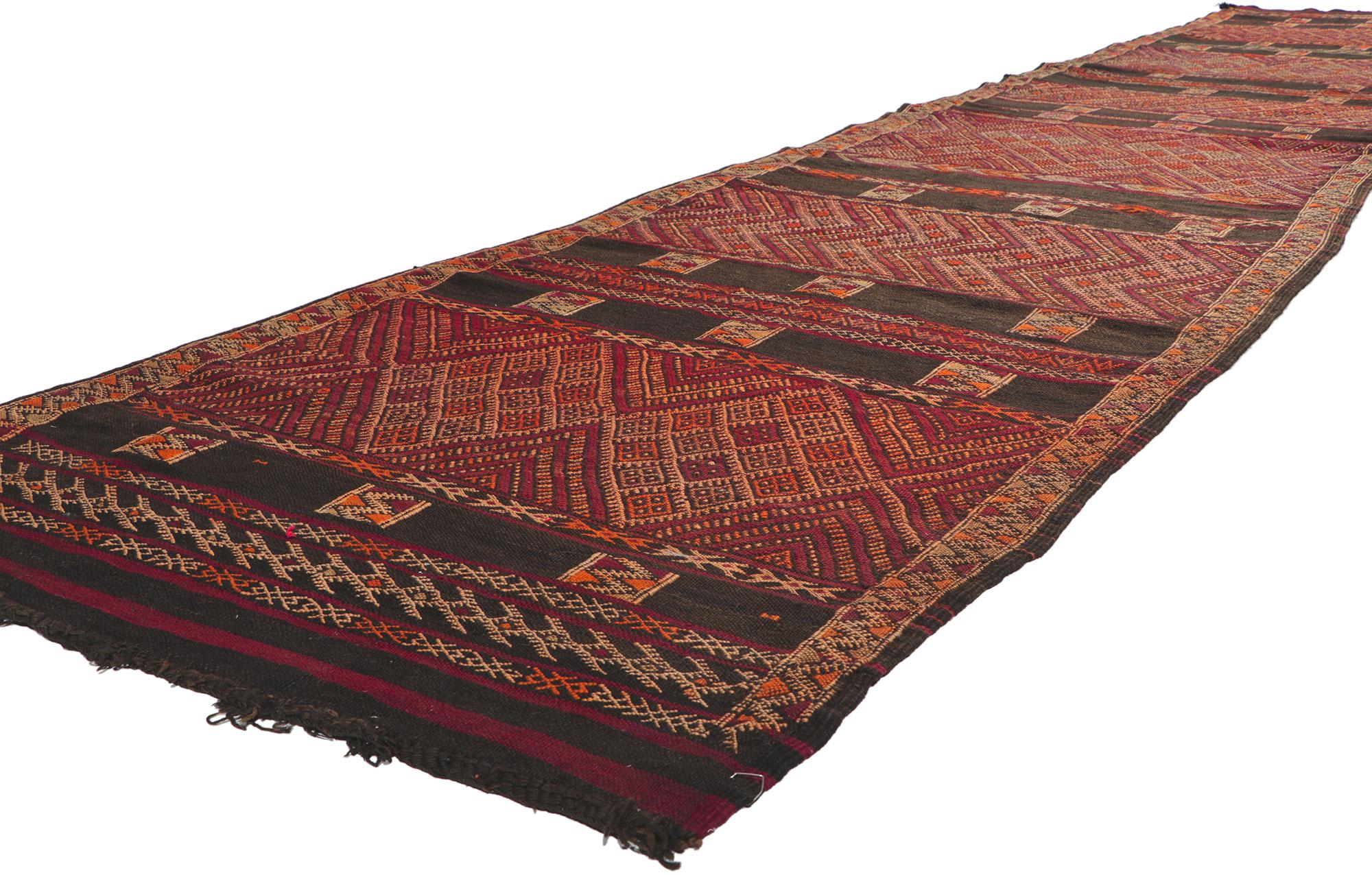21702 Vintage Zemmour Moroccan Kilim runner, 03'09 x 18'04. Full of tiny details and nomadic charm, this hand-woven wool vintage Zemmour Berber Moroccan kilim rug runner is a captivating vision of woven beauty. The abrashed field features an allover