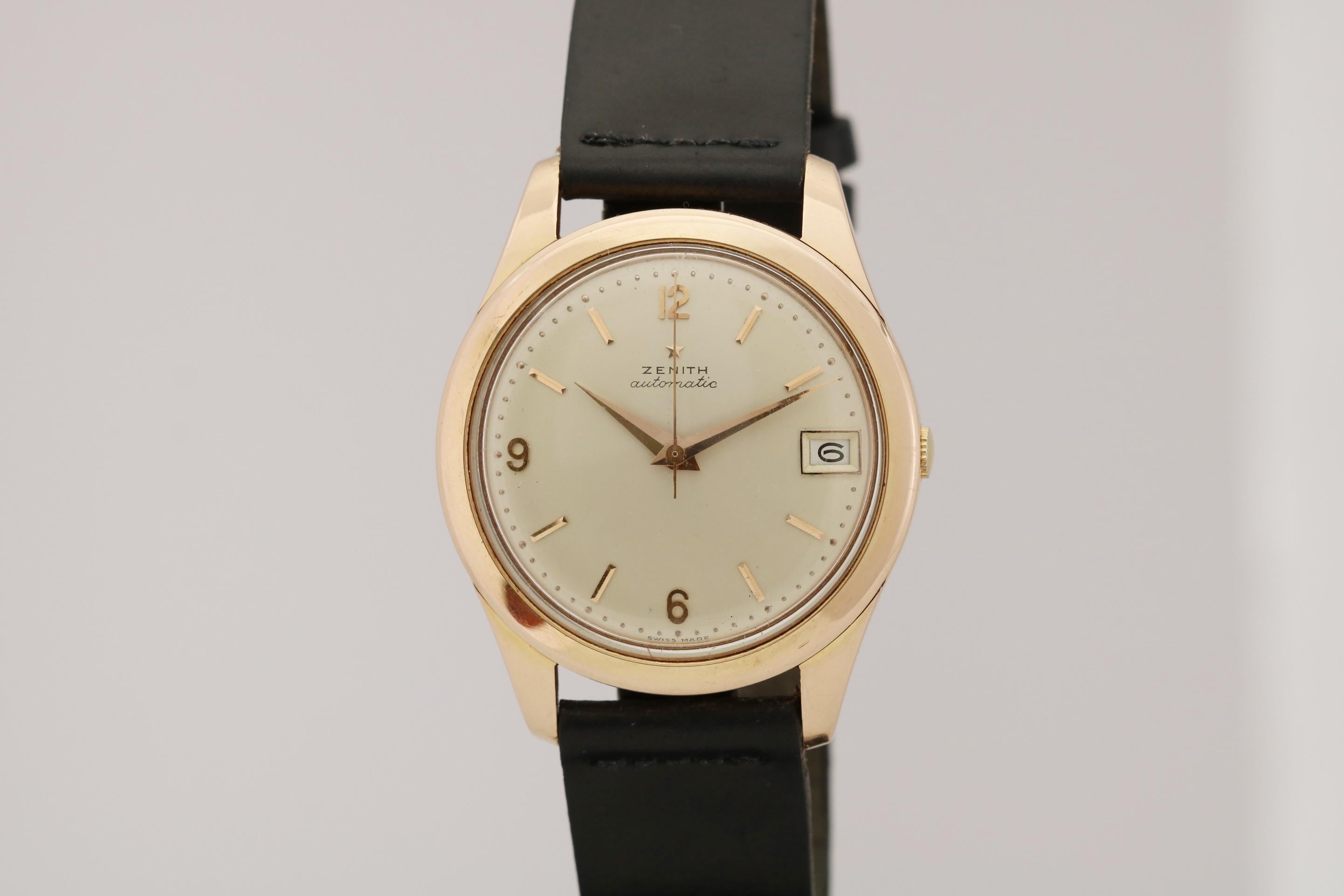 This is a nice and large Zenith Automatic in 18kt Pink Gold from the late 1950's/early 1960's. The watch has a gorgeous matte dial with applied arabic and slash markers with gold daphine hands. There is also a date aperture at 3 oclock. The large