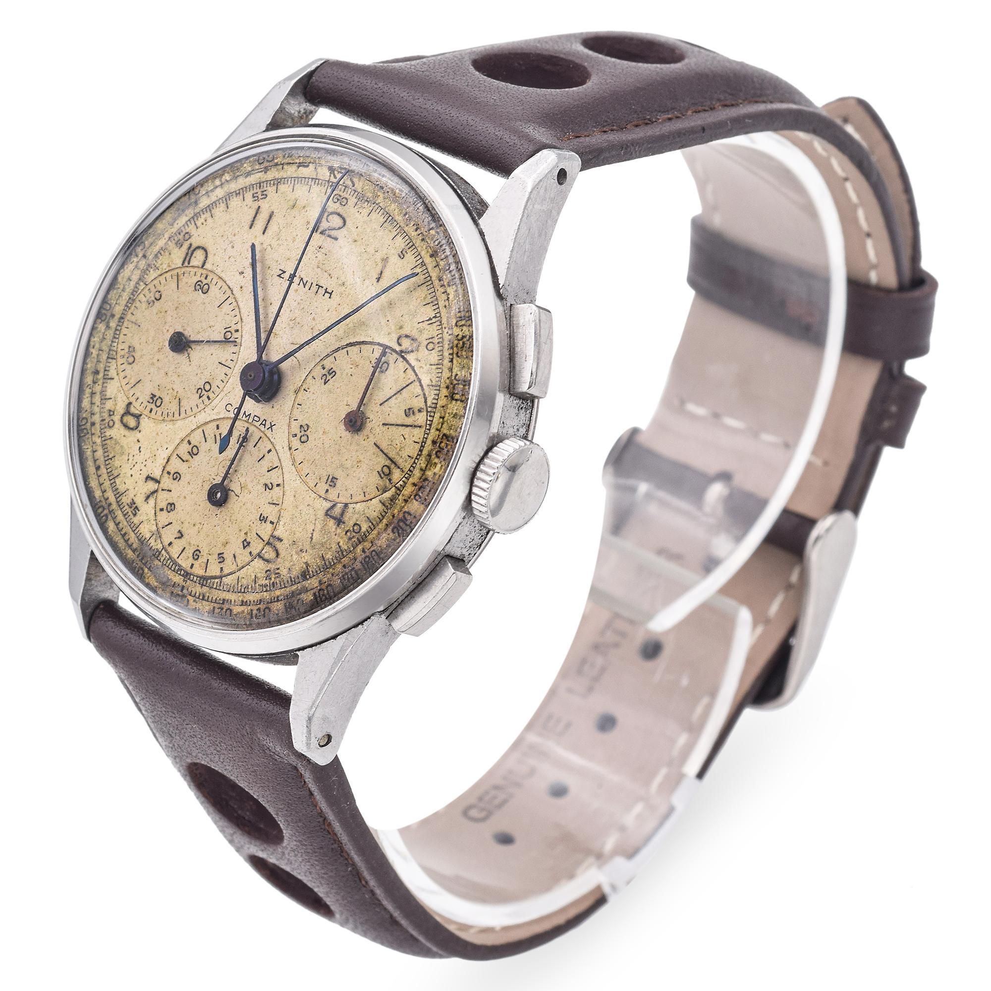 Brand: Zenith
Model: Compax
Case Size: 36mm
Caliber: 156
Movement: Hand Wind
Material: Stainless Steel
Size: 7 1/2
Weight: 45.7 Grams
Condition: Good Vintage Condition, Minor Scratches on Crystal, Keeping Good Time
Notes: Engraving on back

Item #: