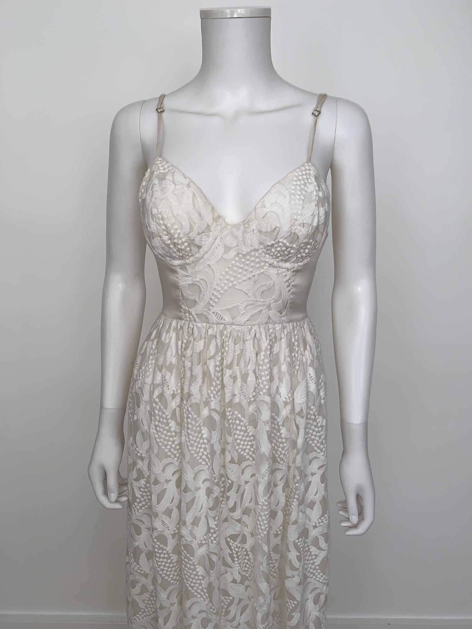 Vintage dress Zimmerman 
- Sleeveless and long length 
-  Open back dress
- Full embroidered dress 
- The to of the dress is like a bra fitting like a size Small 
- Fitting is very flattering
- Size Small 
- Very good condition 