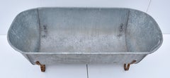 Baignoire vintage en zinc avec pieds en fer