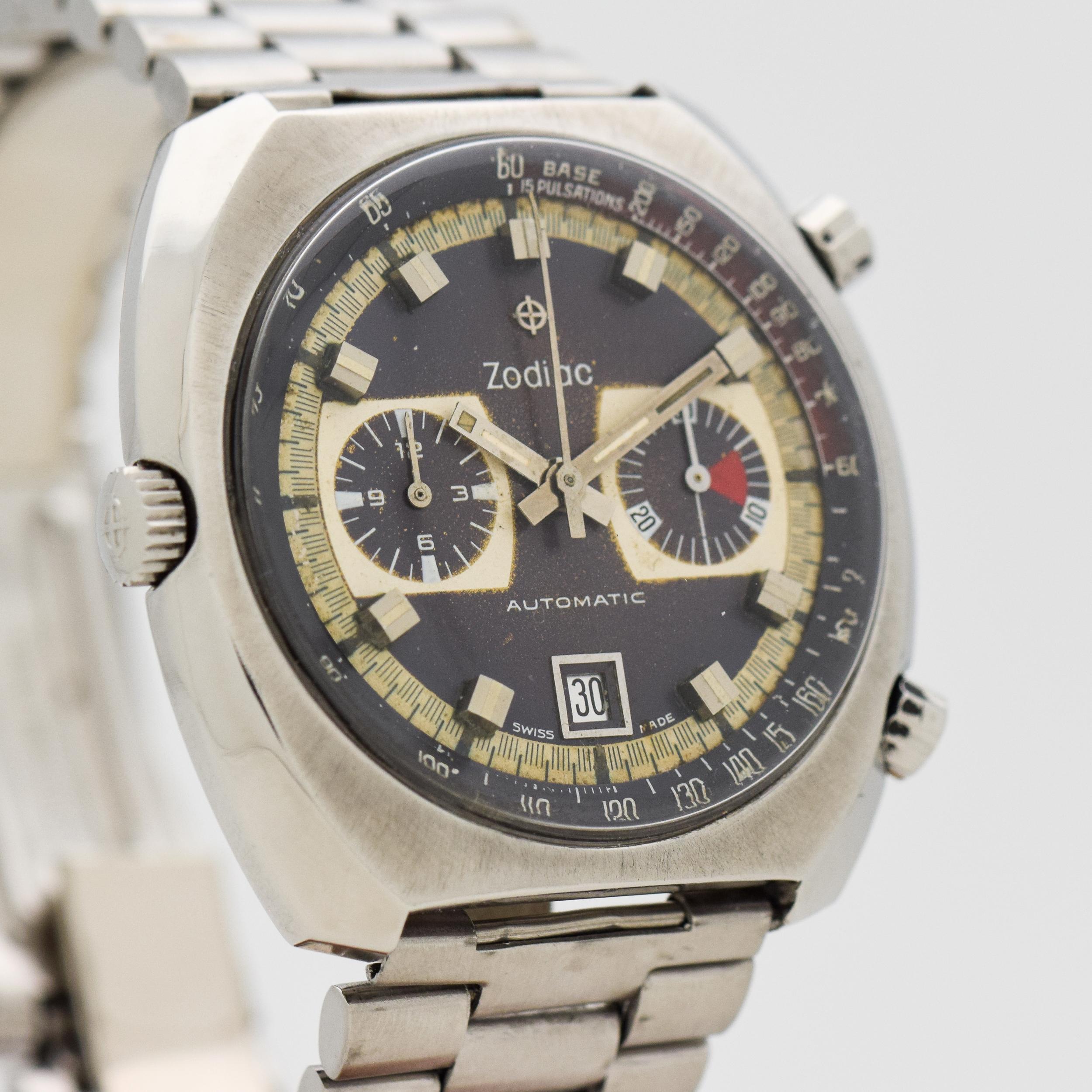 1970's Vintage Zodiac 2 Register Chronograph Stainless Steel Case with Original Two Tone Blue/Purple and Gray Dial with Applied Square Steel Markers with White Inlay with Original Zodiac Stainless Steel Bracelet. 42mm x 43mm lug to lug (1.65 in. x