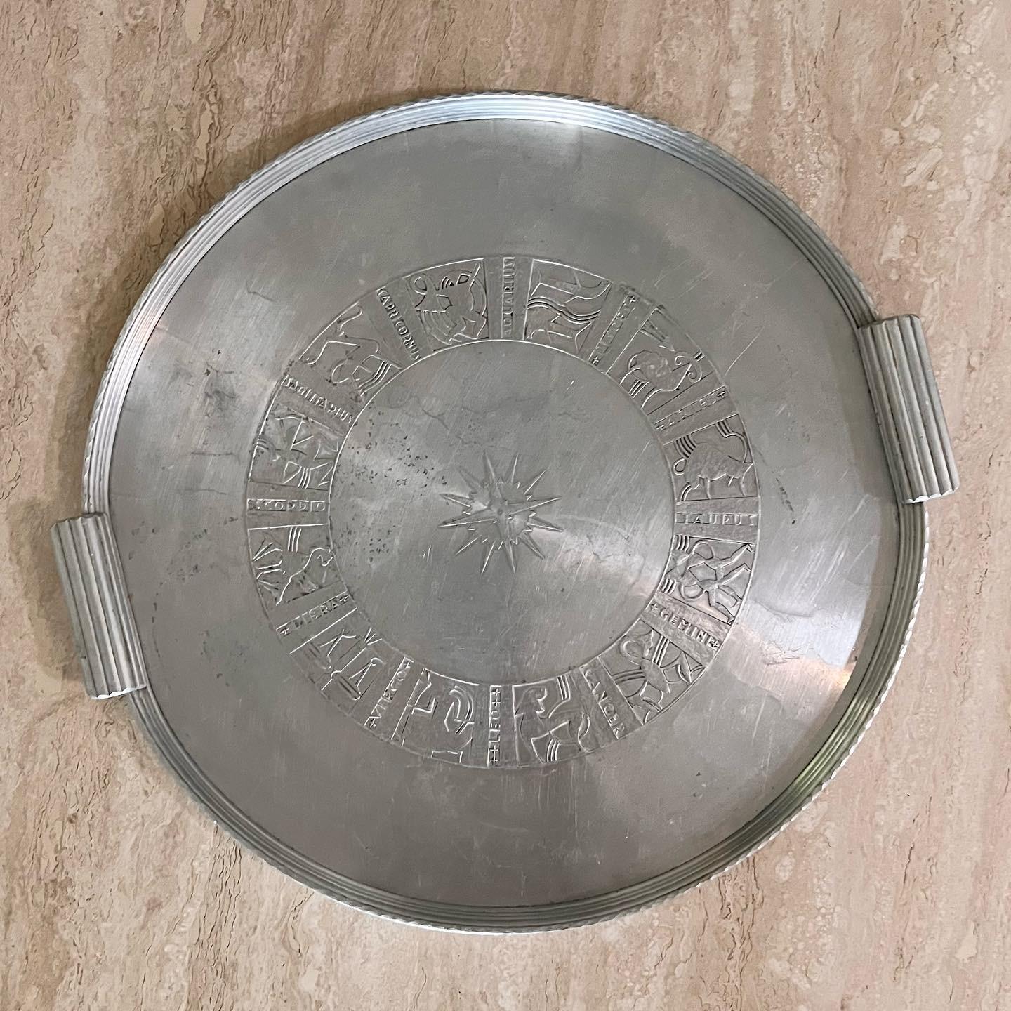 WHAT’S YOUR SIGN? a vintage metal zodiac serving tray by Arthur Armour, 1960s. Hand-crafted hammered aluminum; maker’s mark in photos. Featuring Aries, Taurus, Gemini, Cancer, Leo, Virgo, Libra, Scorpio, Sagittarius, Capricorn, Aquarius, and Pisces.