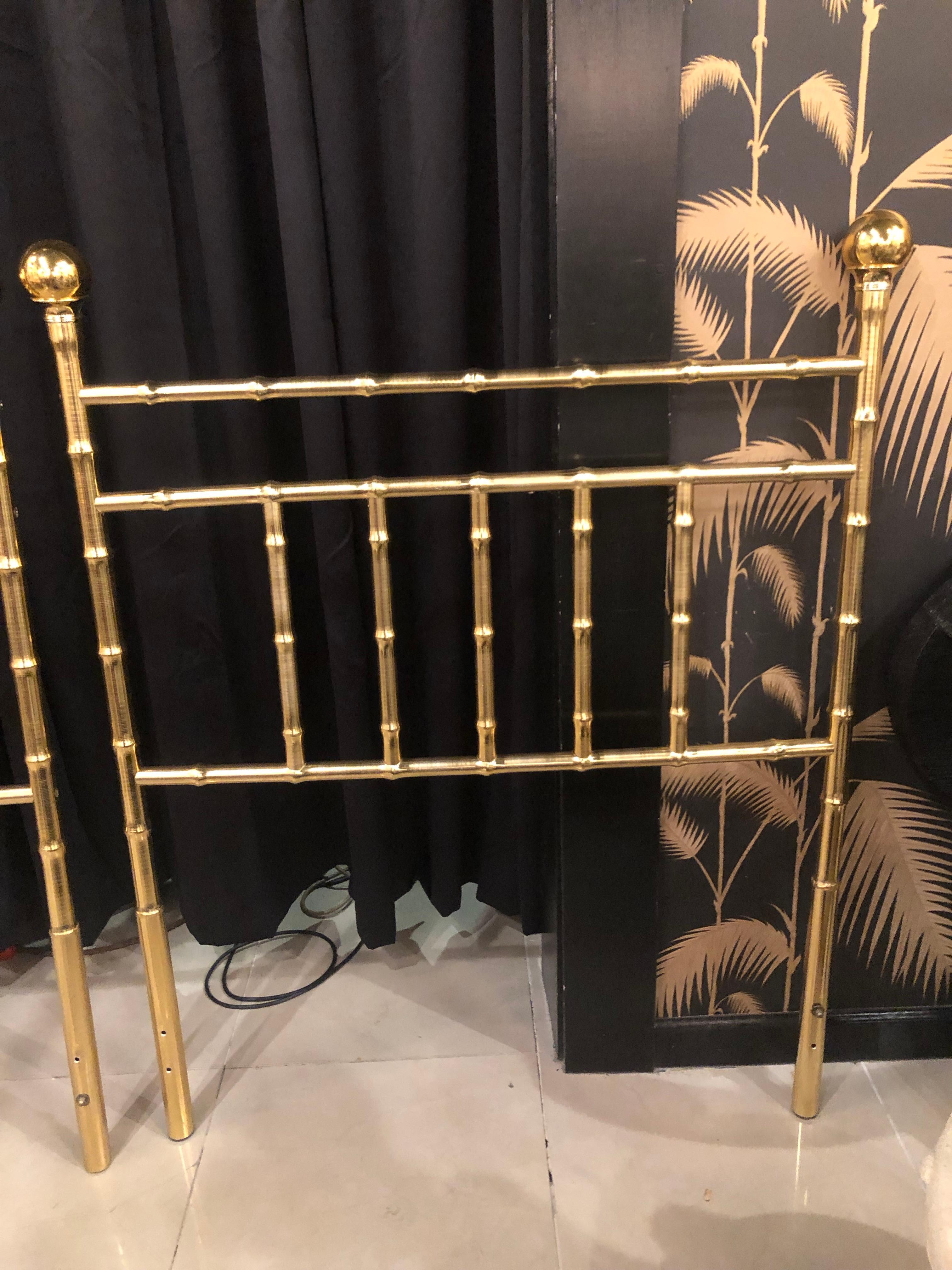 Lovely pair of vintage twin size Hollywood Regency headboards. Faux bamboo brass design. Has a few minor scuffs to the original vintage finish.