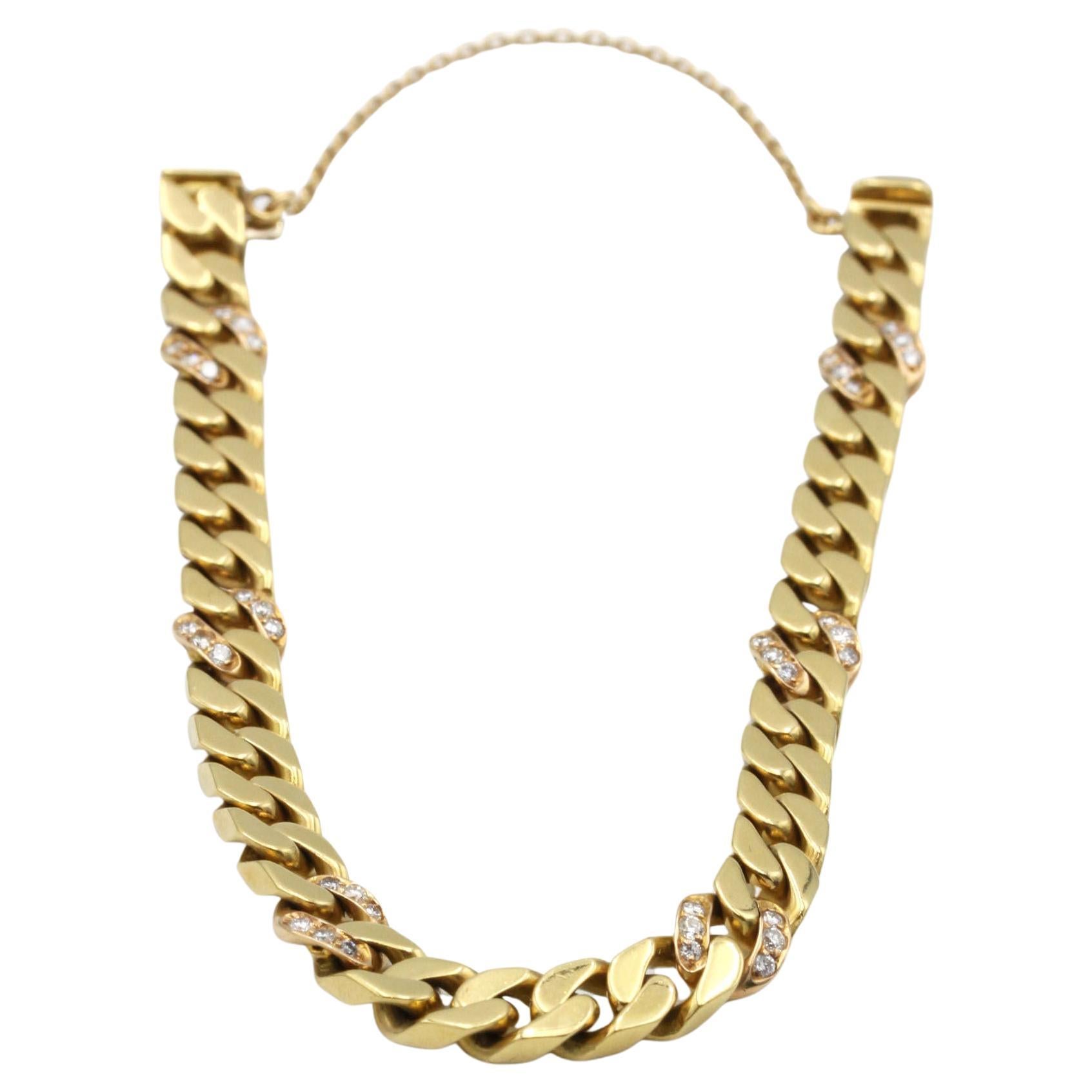 Elevate any look with this substantial 18K yellow gold (750‰) curb link bracelet, weighing 31.58 g of solid gold. Crafted in a bold, vintage-inspired style reminiscent of 1970s high-jewelry chains, each flattened, interlocking link catches the light