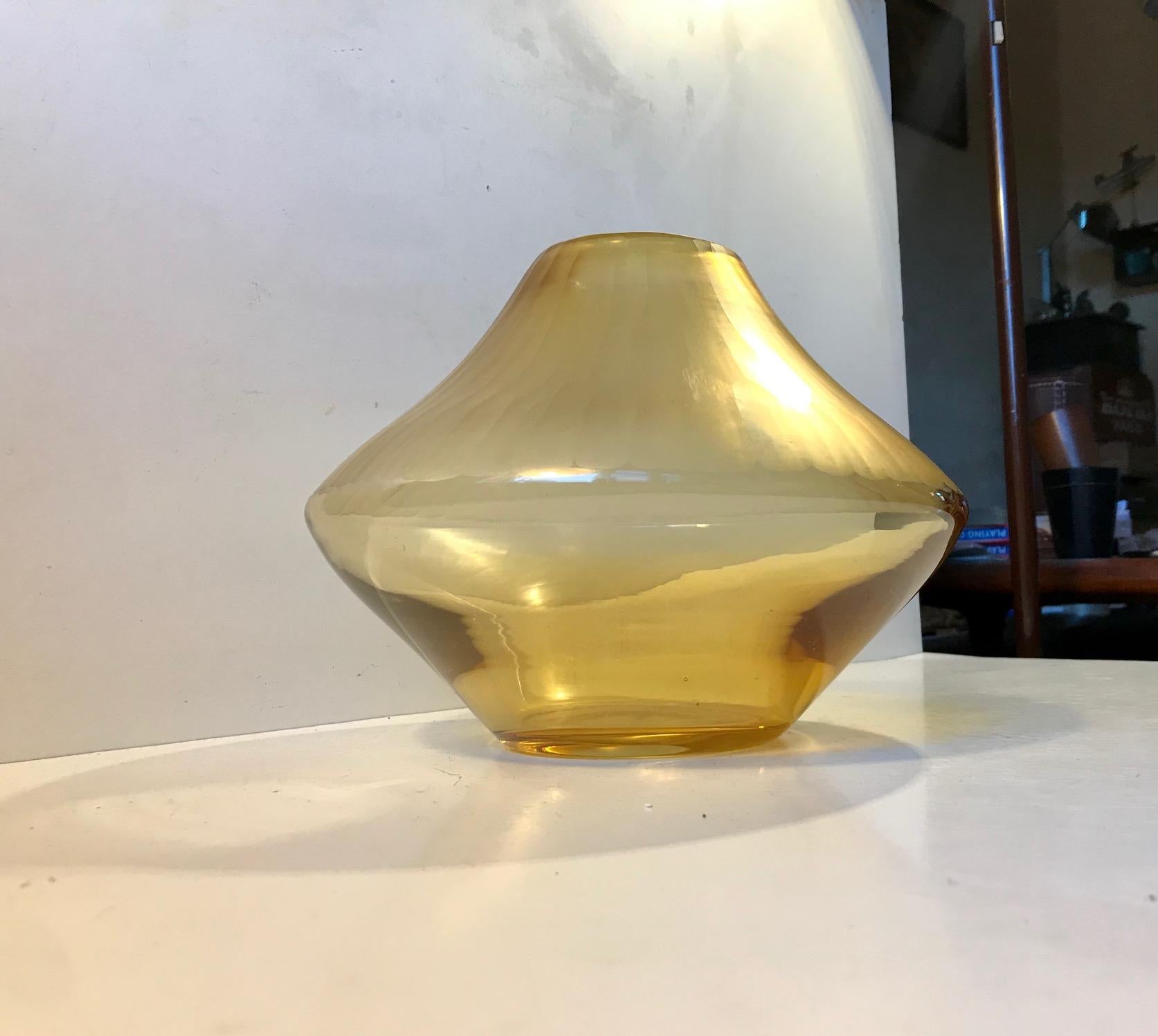 Large and wide hand blown Amber glass vase. The top of the vase frosted. A cutting and sanding technique that leaves the surface of the glass like Satin despite the texture. This vase was made at Kosta Boda in Sweden during the 1970s. It is possibly