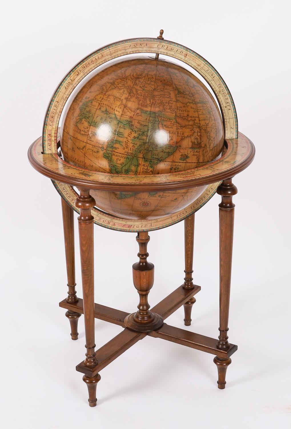A fine vintage walnut terrestrial sixteen inch library globe on stand in 17th Century style, by Donati, Milano, Italy,  Circa 1960 in date.

The stunning globe is in 17th Century style, is written entirely in Latin and is raised on a highly