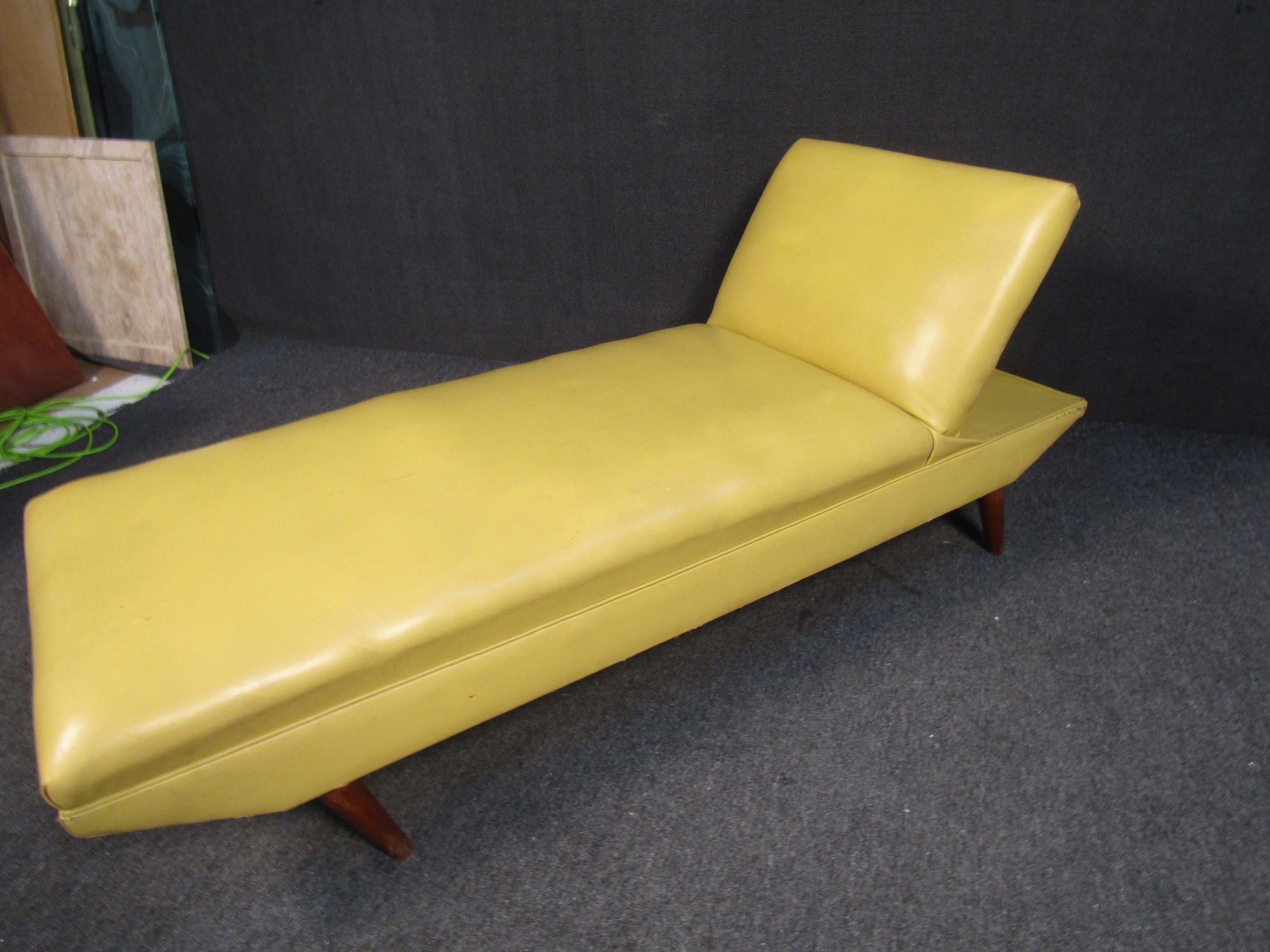 Pairing a vibrant upholstery with walnut legs and frame, this Mid-Century Modern chaise lounge could be used as a massage table or as a comfortable yet stylish place to recline. Please confirm item location with seller (NY/NJ).