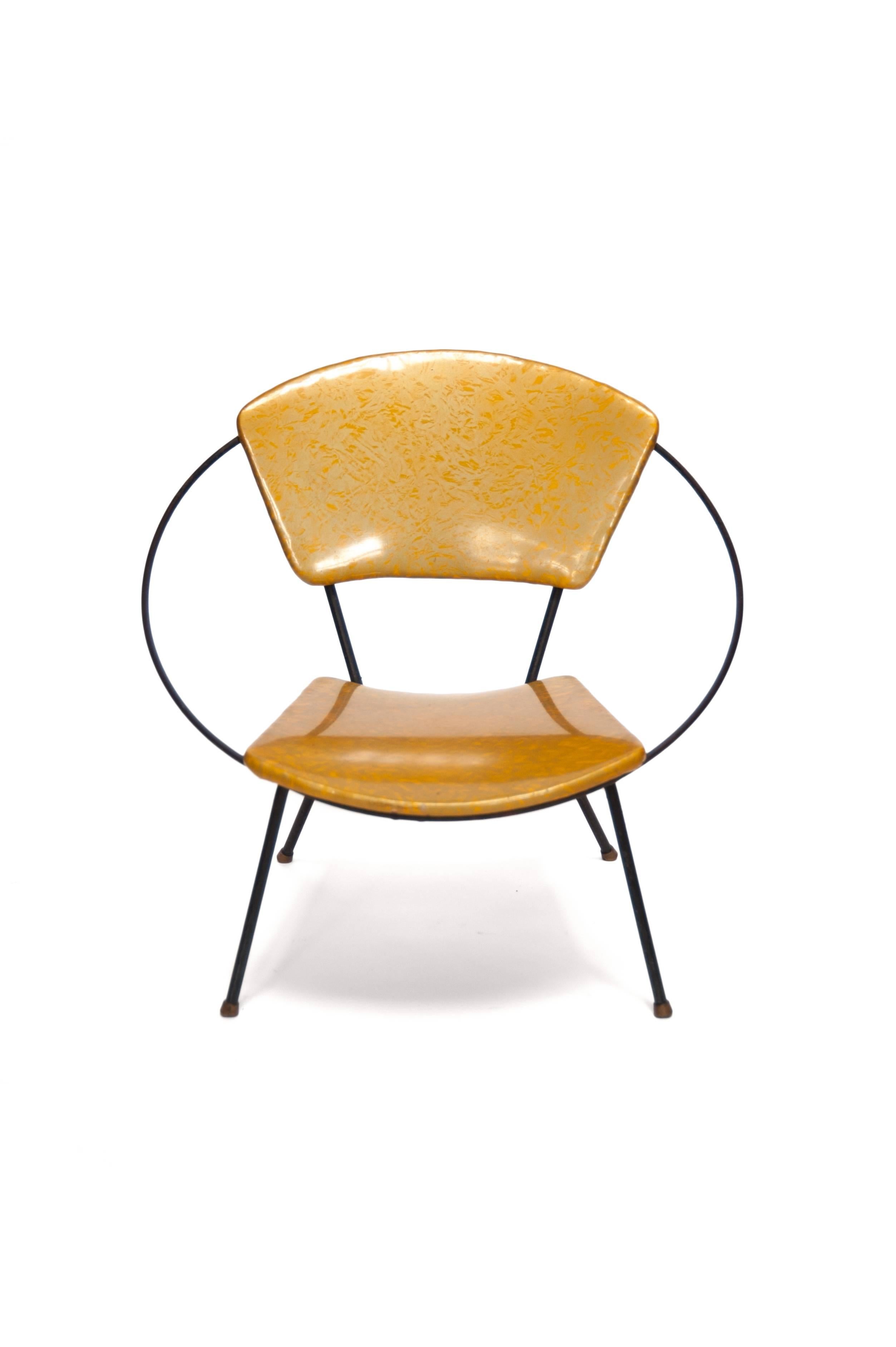 Vinyl circle child chair, designer unknown, USA, 1950s

Designer unknown, USA, 1950s
Iron, vinyl upholstery
Measure: H 17.75 in, W 19 in, D 18.75 in (seat H 8.5 in).