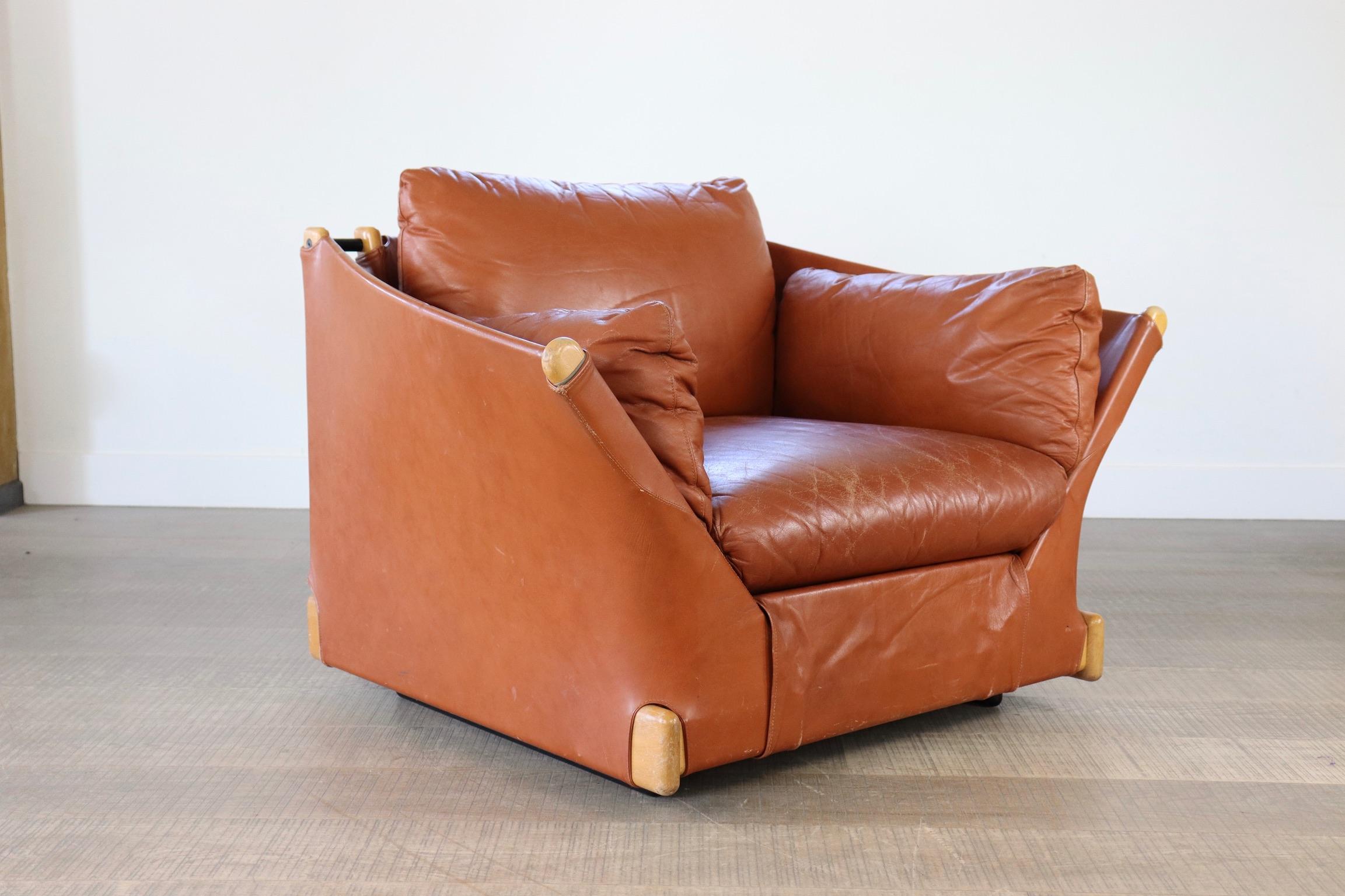 Cassina 'Viola d'amore' Armchair by Piero de Martini, 1977. Remarkably comfortable, magnificent cognac leather seats in amazing vintage condition, as Cassina is known for its use of high-quality materials. The Down-filled cushions make these club
