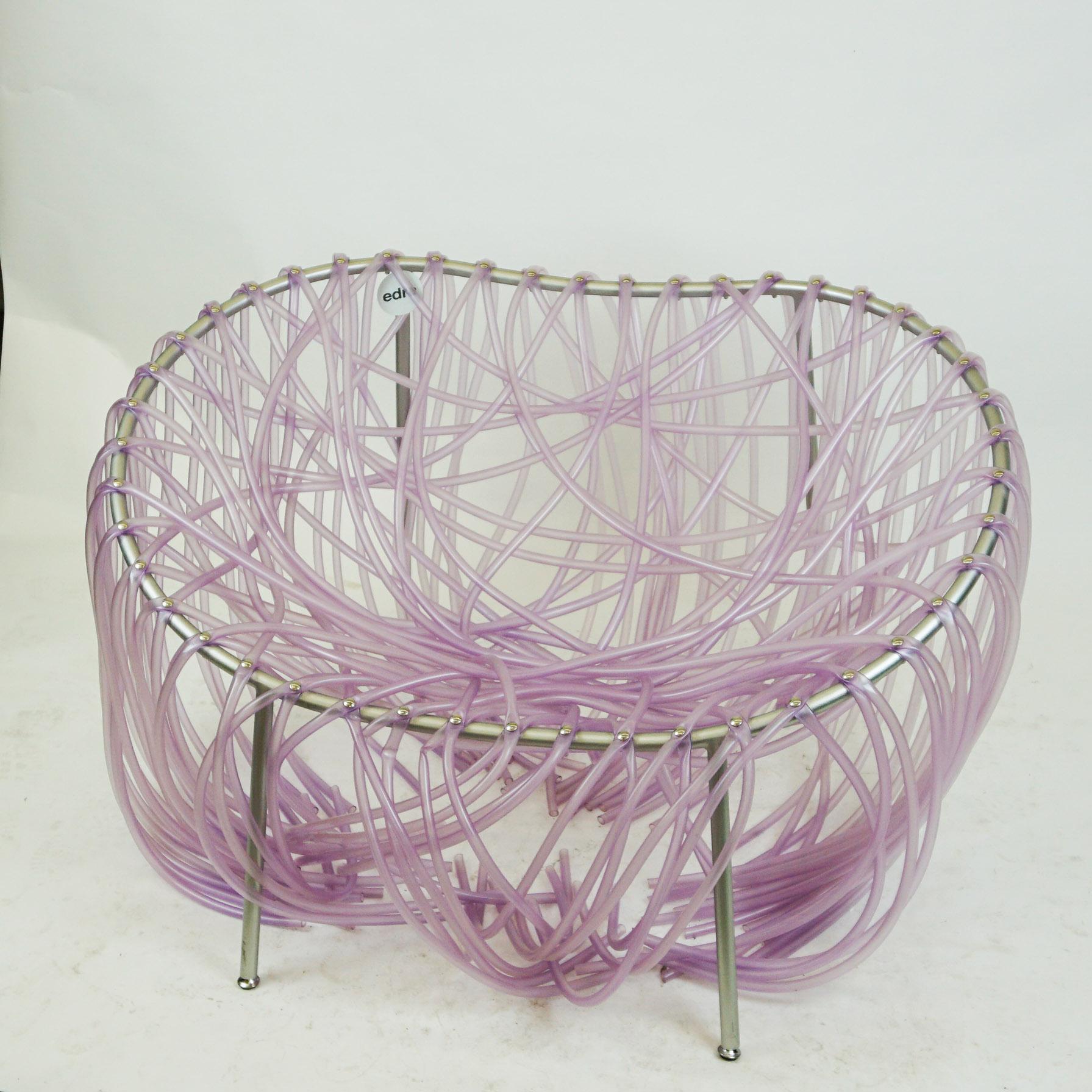 This violet Anemone chair has been designed by the Brazilians Fernando and Humberto Campana and manufactured by Edra, Italy, 2001.
It features special hollow tubes in plastic which are handwoven methodically and screw-attached to the corolla-shaped