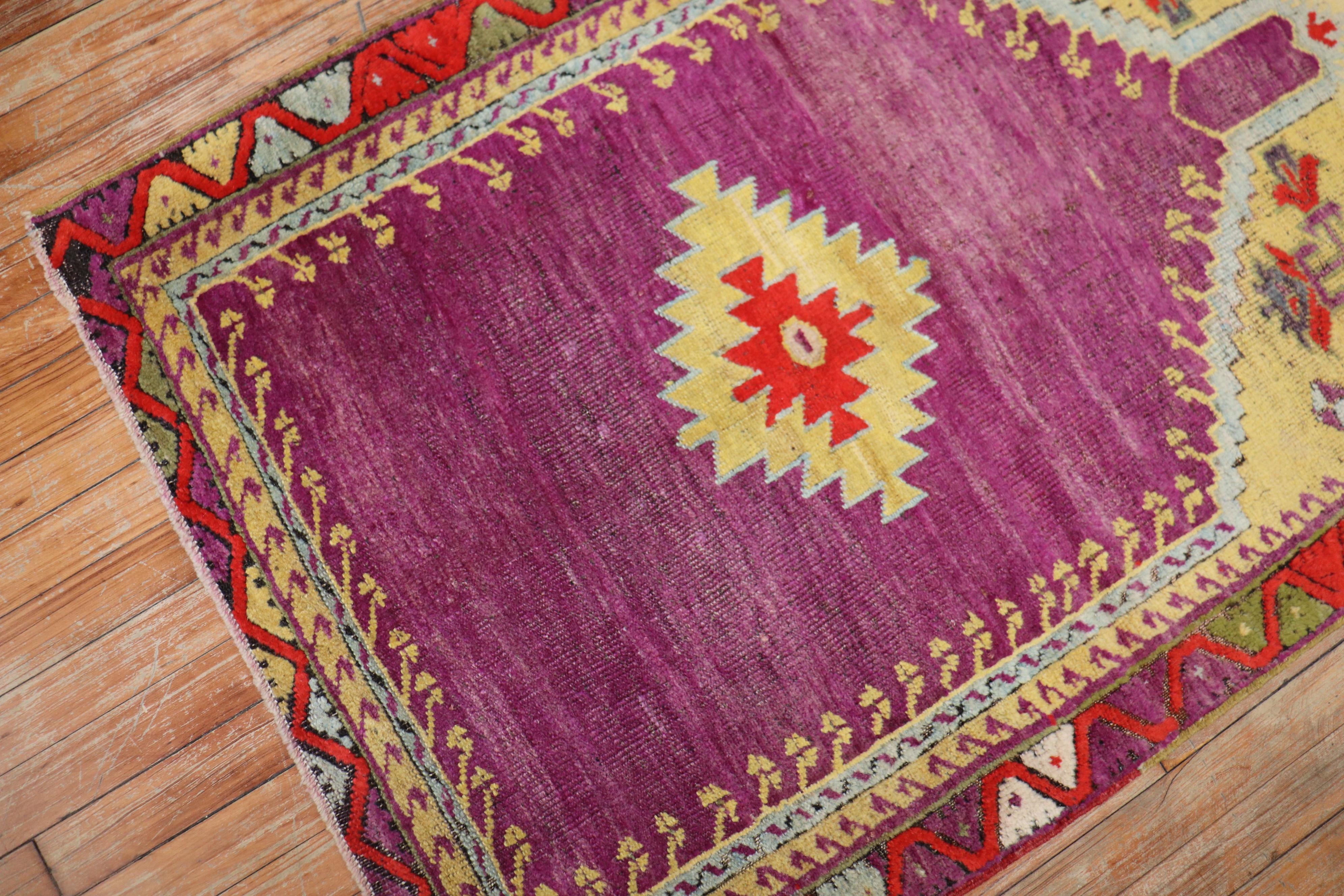 A one of a kind Boutique looking hand knotted scatter size early 20th century Turkish Melas Prayer Niche Rug. The field is a deep purple/violet color. Havent seen many in this color palette. Its light enough to be used as wall decoration