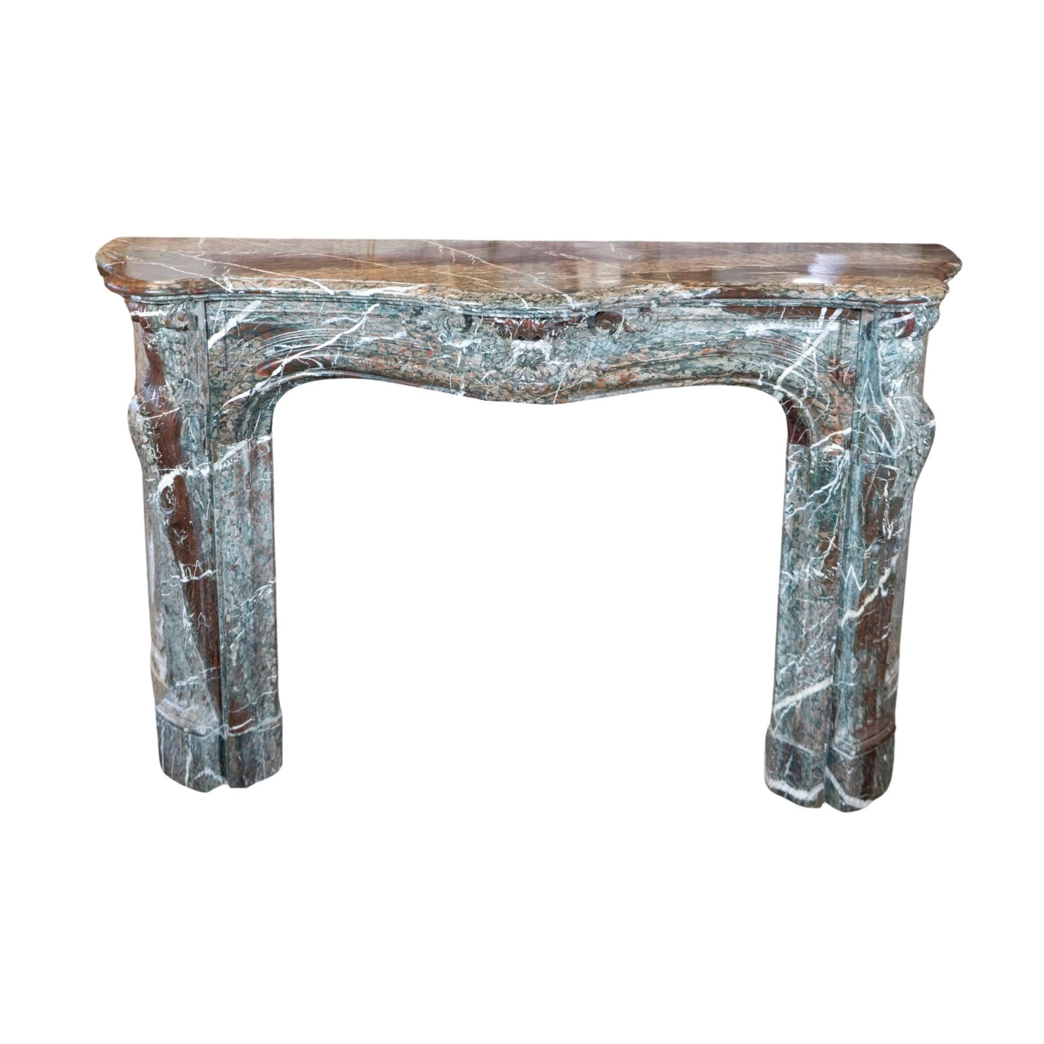 This French Grand Mix Campan Marble Mantel is a stunning and historical addition to any home. Handcrafted from a blend of Grand mix and Ribboned Campan marble originating from France in the 18th century, it adds a touch of elegance and class to any