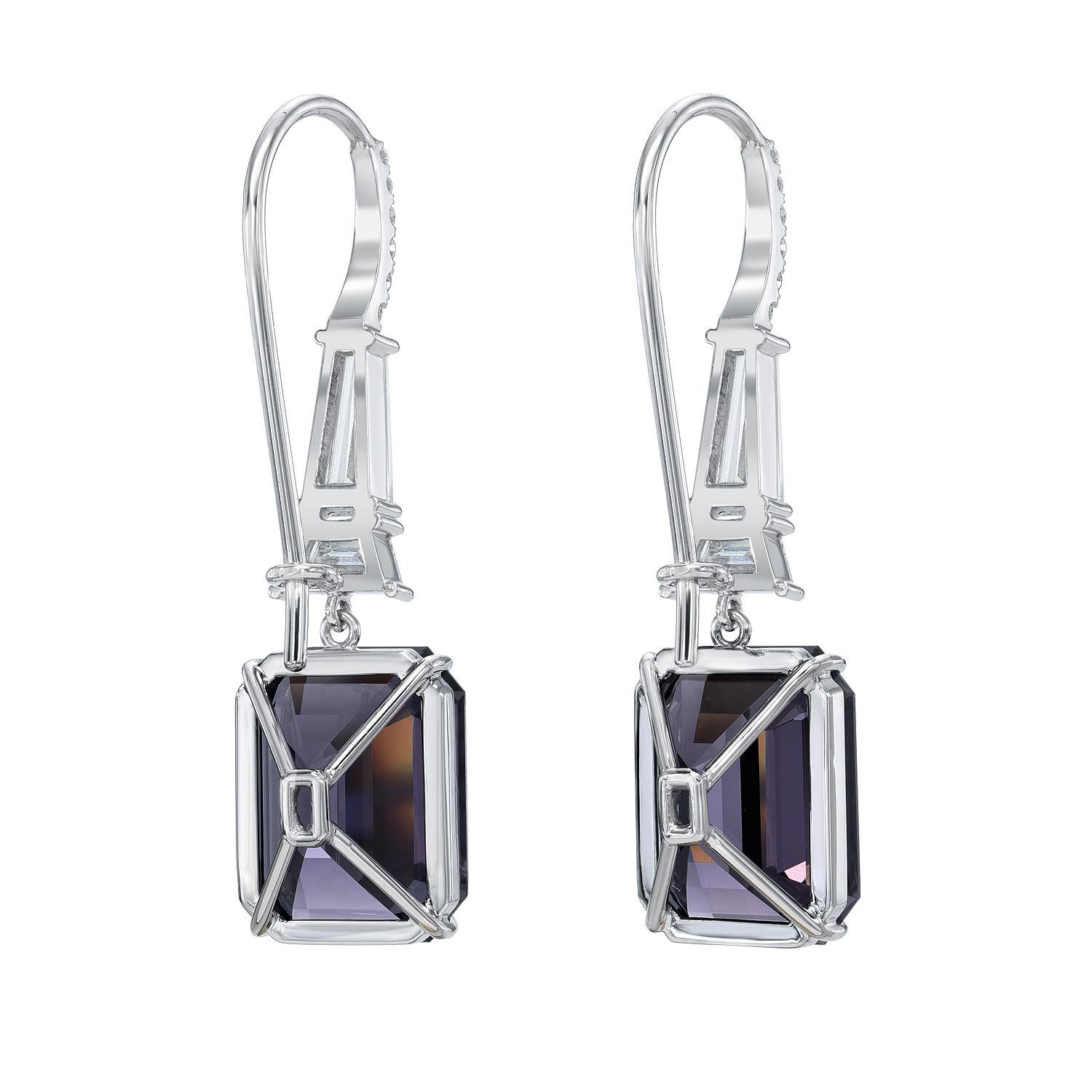 Ultra exclusive 13.12 carat, bright, Grey-Violet Spinel, emerald-cut earrings, decorated with a total of 0.65 carat E-F/VVS1 tapered baguette diamonds, a pair of 0.37 carat E/VS1 trapezoid diamonds, and a total of 0.15 carat round brilliant