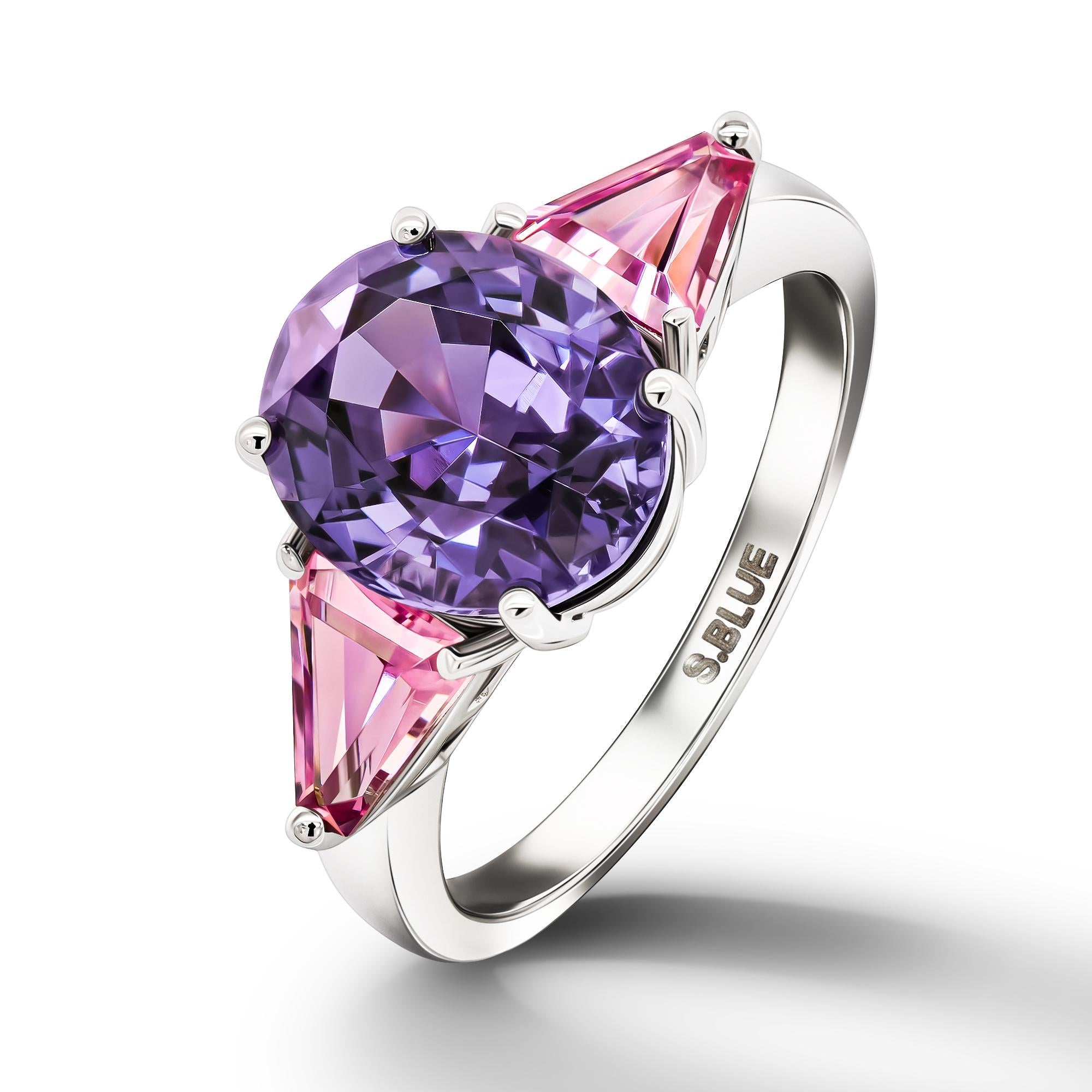 •	18K White Gold.  
•	Violet Spinel in oval cut – total carat weight 3.26.
•	Pink Spinels in triangle cut – total carat weight 0.92.
•	Product weight – 3.62 grams.
•	Ring size – 5.5’.
