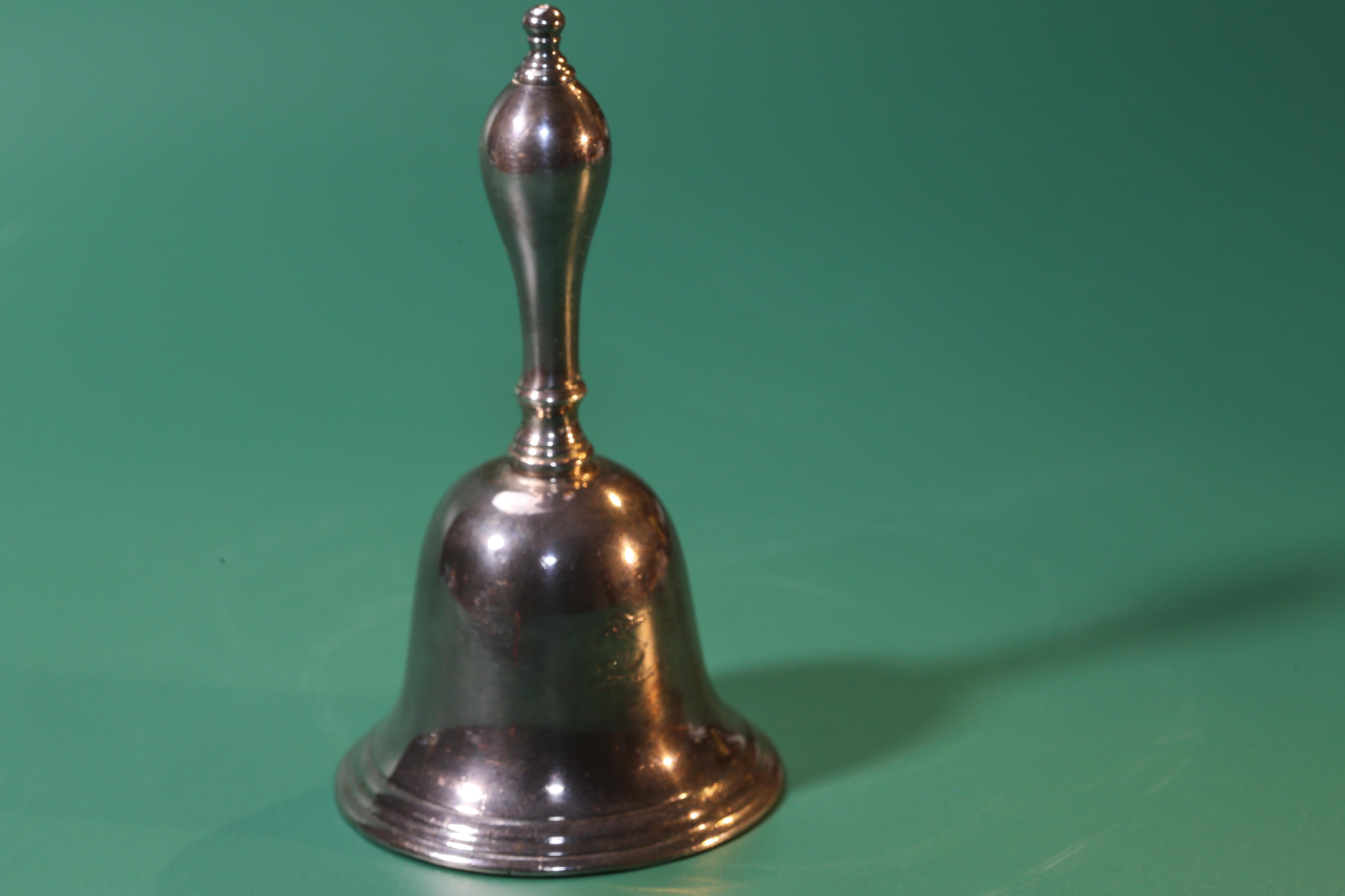 Violet Trefusis's George II silver table bell, mark of Thomas Mason, London, 1722.

Of typical part-reeded form, the handle with baluster knop, engraved with a crest, the clapper perhaps later, marked inside

Measures: 4¾ in. (12.1 cm.) high 
7 oz.