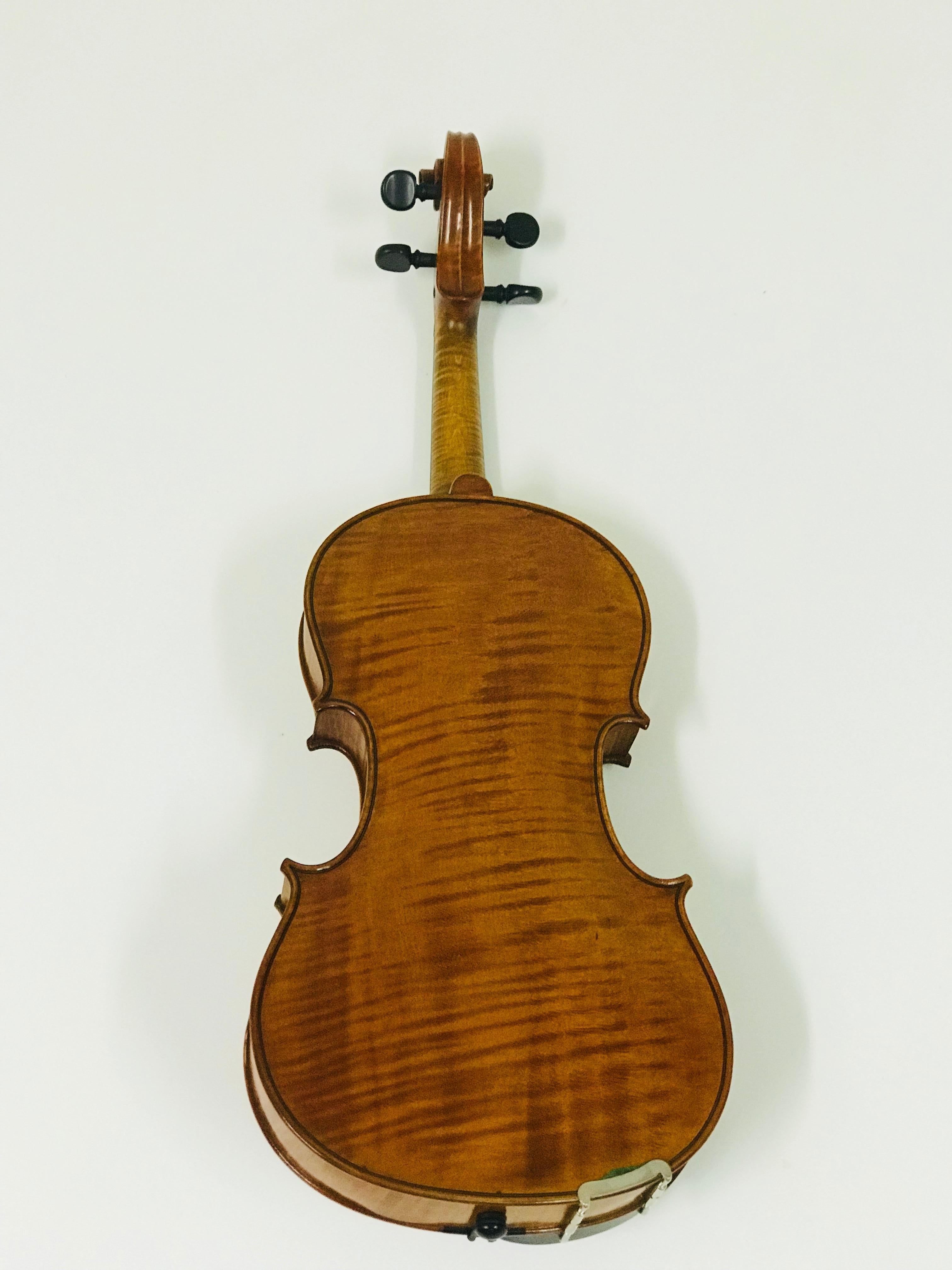This extremely nice violin was made by Fritz Mönnig about the year 1923 in Markneukirchen in Germany. Mönnig made the violin with amazing color smooth tone. The author's violin is charakterized by excellent work. The back part is 35.6 cm.