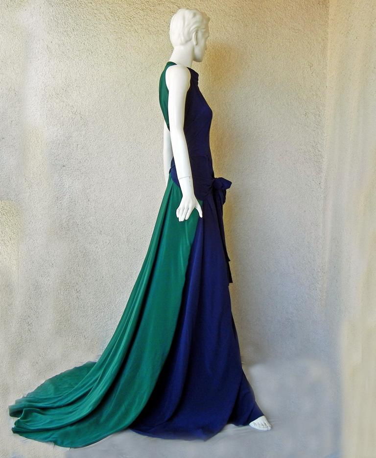 Vionnet navy and emerald green silk crepe de chine gown with crisscross back and tie waist. Bias cut with a flowing drape to the body.  Stunning colorblock pattern showcases a very visual and dramatic back and train.   Concealed button fastening at