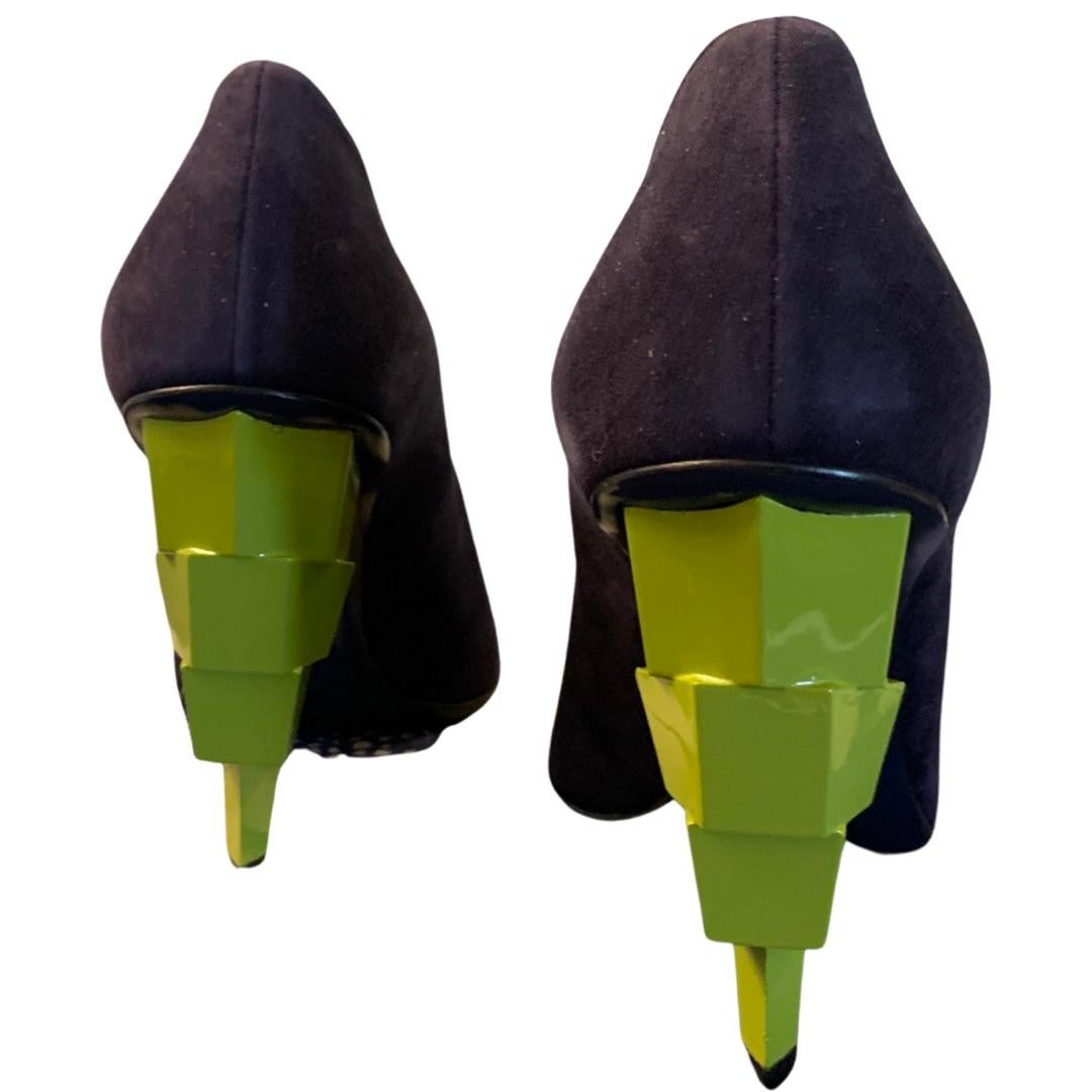 Shoes as Art. That’s the only way you can describe these amazing shoes designed by the house of VIonnet, Paris. A dark navy suede pump becomes art with a lacquered chartreuse stacked sculpture as the heel. Just spectacular. European size 37. True to