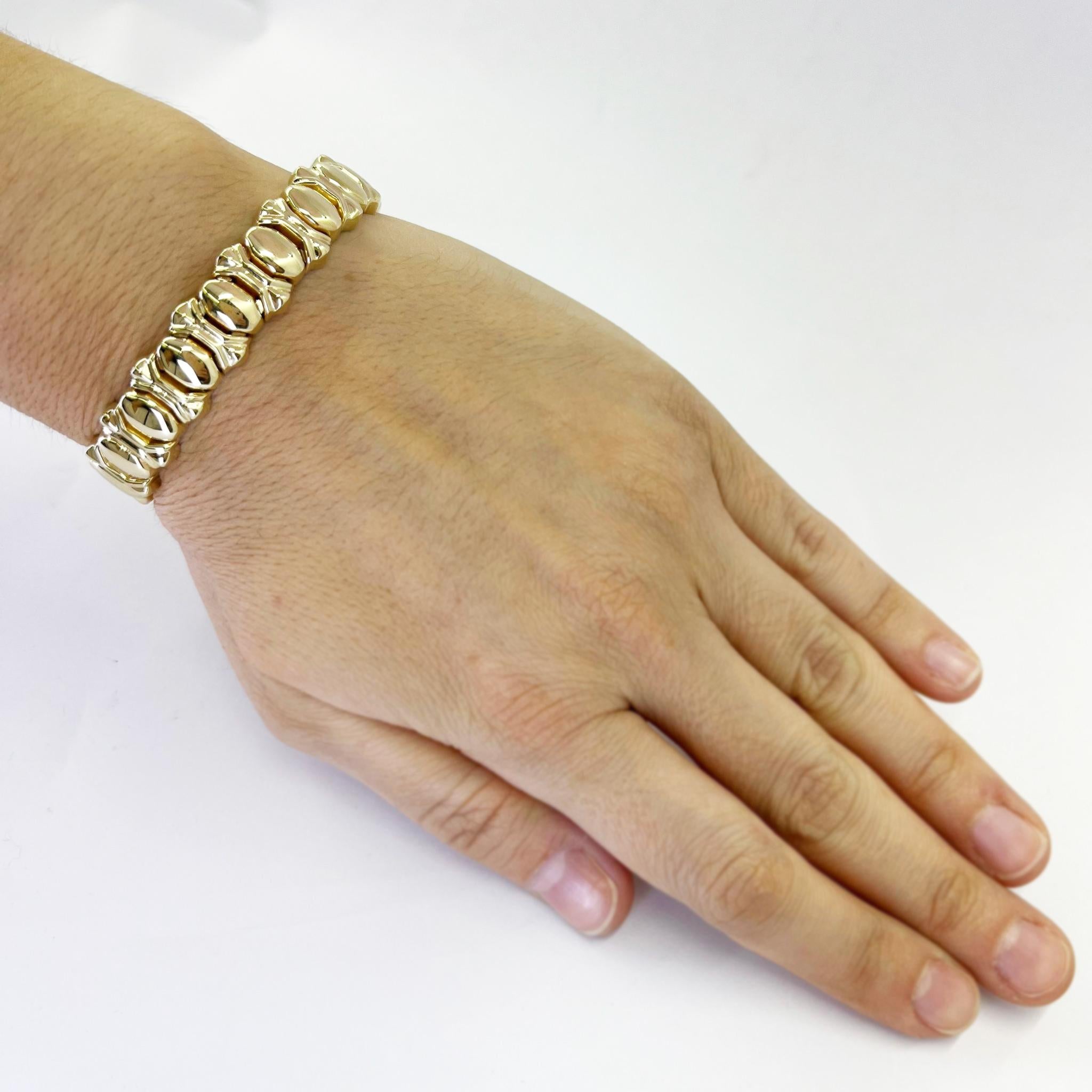 Vior 14 karat yellow gold flex cuff bracelet with high polish design. Open back. Made in Italy. Finished weight is 29.0 grams.