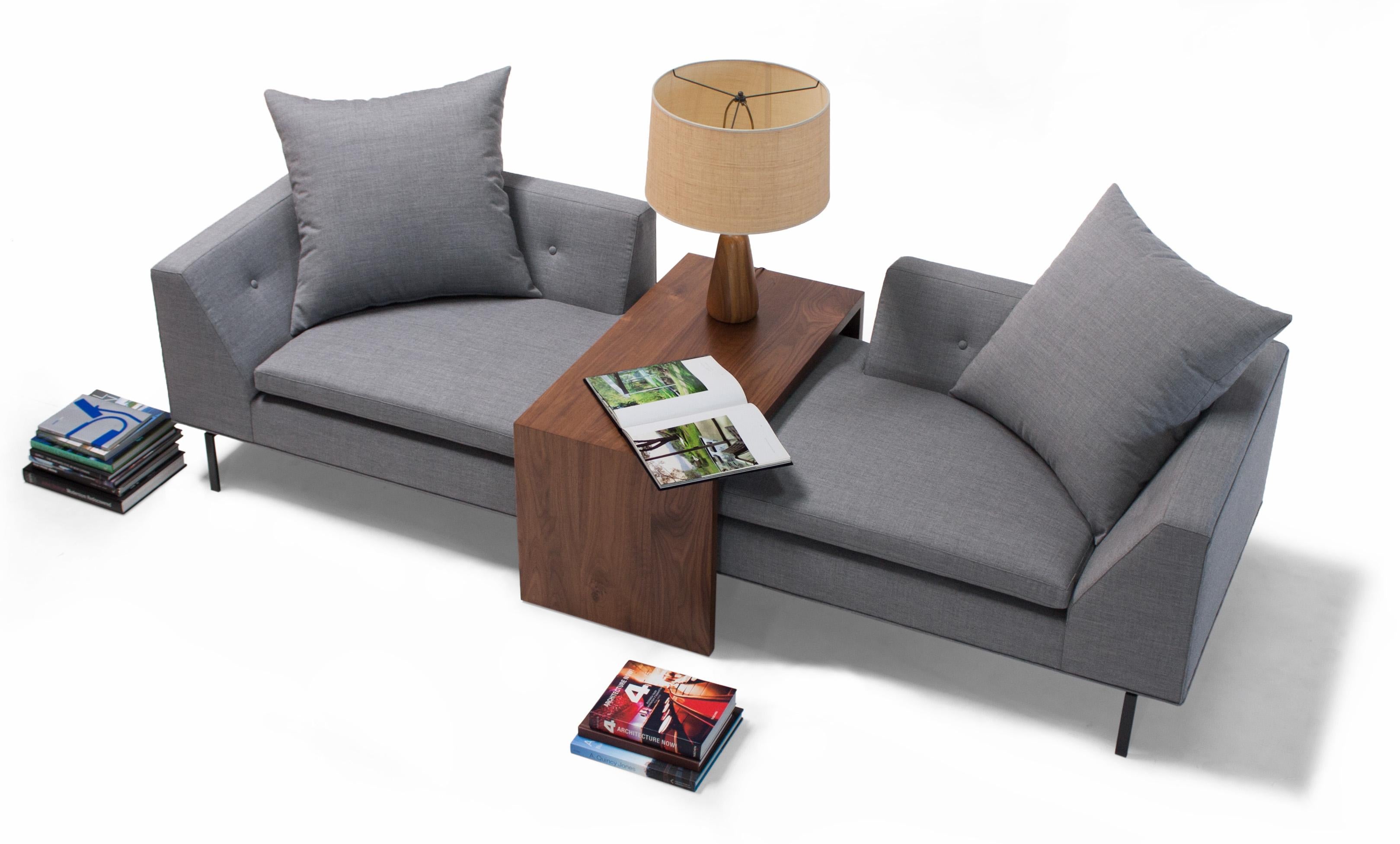 Clean-lined and comfortable, the Fratelli Group is made up of two chairs and a solid wood table and can be arranged in a traditional “sofa” style or as a deep, relaxing lounge. The integrated table ensures easy access to lighting, drinks, and the