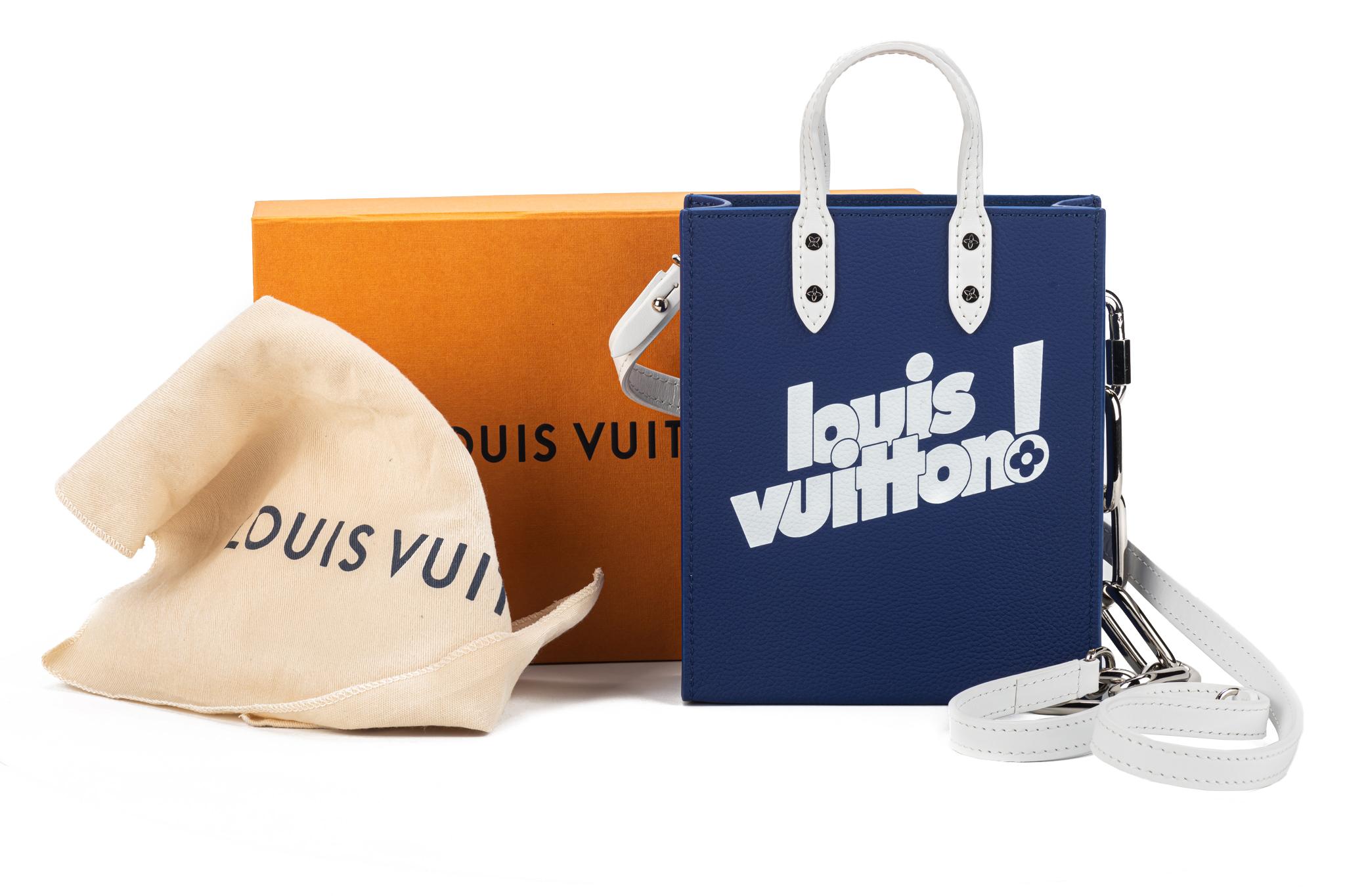 Louis Vuitton Virgil Abloh Blue Cowhide Everyday LV Sac Plat XS Silver Hardware from 2021. The bag is lined with tonal microfiber and includes a shoulder strap. The item is new and comes with the dustcover and box.
