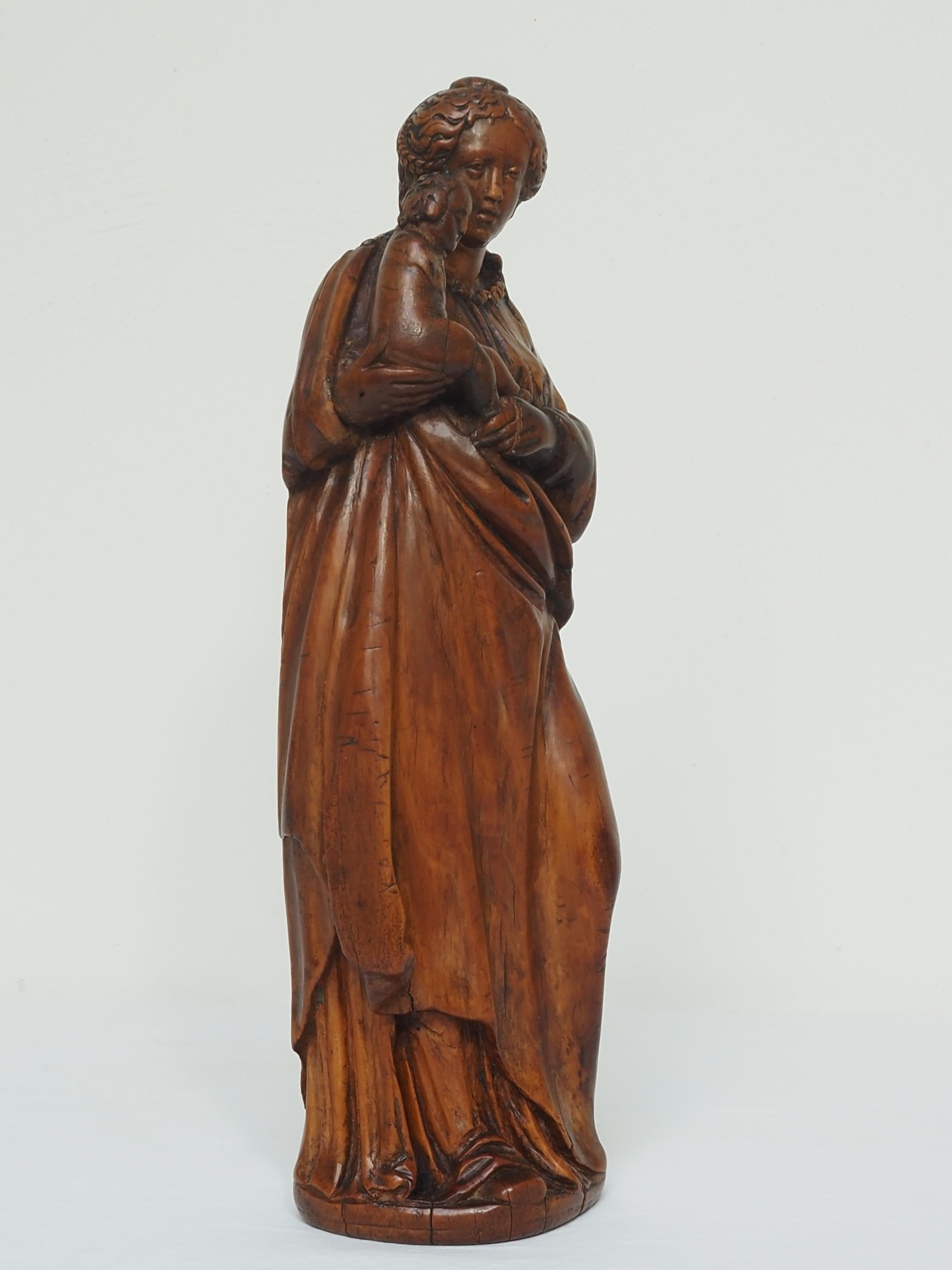 Fruitwood Virgin and Child, Flanders, early 17th century For Sale