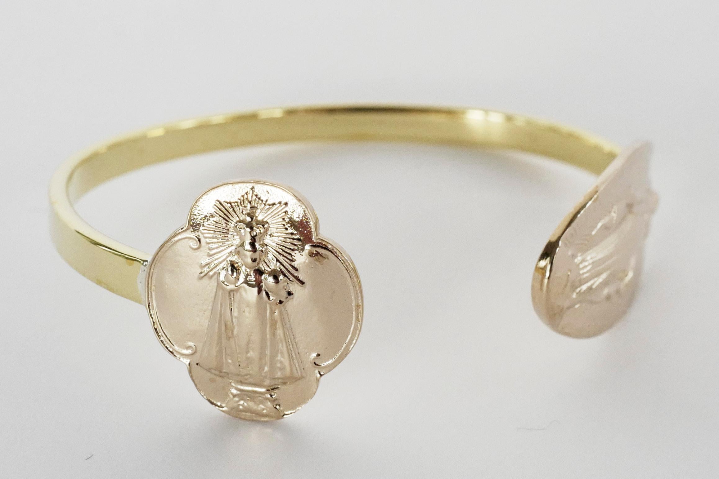 Virgin Mary Medal Bracelet Bangle Cuff Gold Plated J Dauphin

Symbols or medals can become a powerful tool in our arsenal for the spiritual. 
Since ancient times spiritual pendants, religious medals has been used to protect us. During challenging