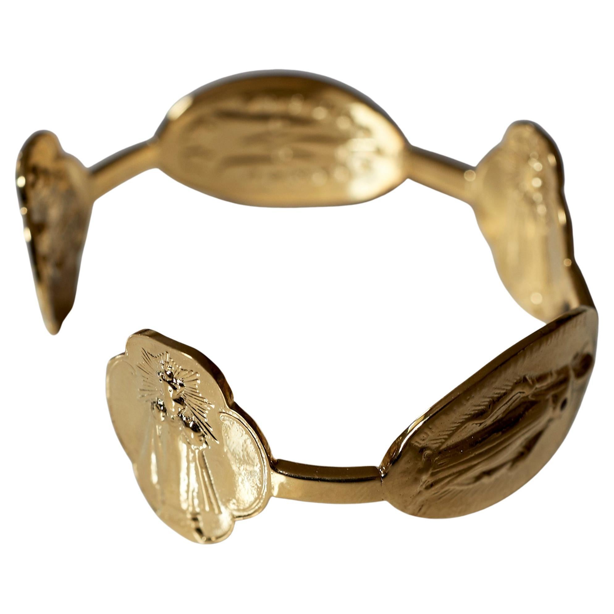 Bracelet manchette Médaille de la Vierge Marie Bracelet Rubis plaqué or

Designer. J DAUPHIN

Les symboles ou les médailles peuvent devenir un outil puissant dans notre arsenal pour le spirituel. 
Depuis l'Antiquité, les pendentifs spirituels et les