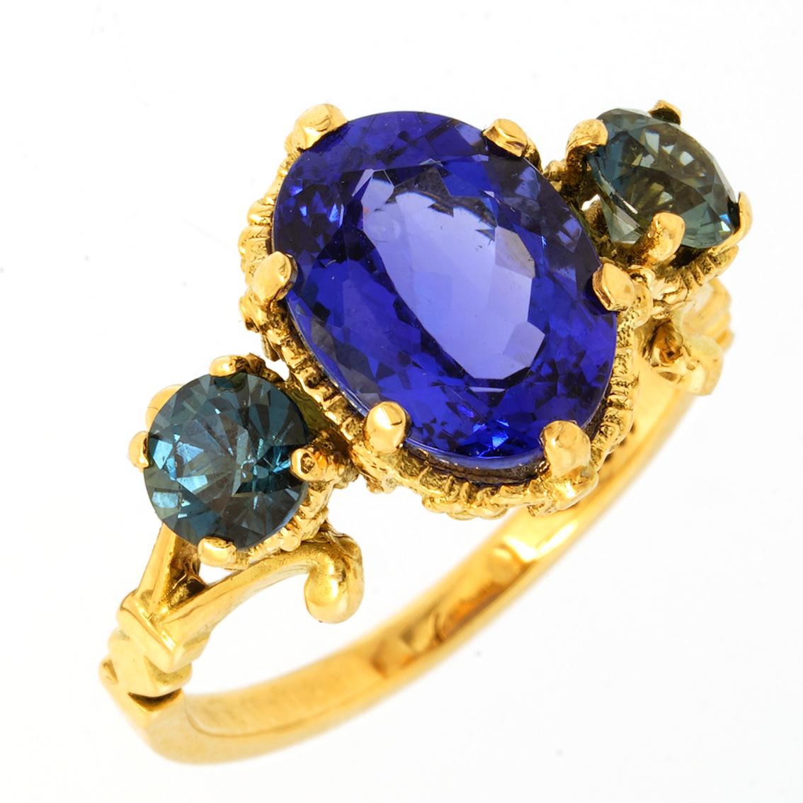 Oval Cut Tanzanite & Sapphires gold ring 