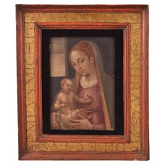 Virgin with Child and little bird. Oil on panel. 16th century.