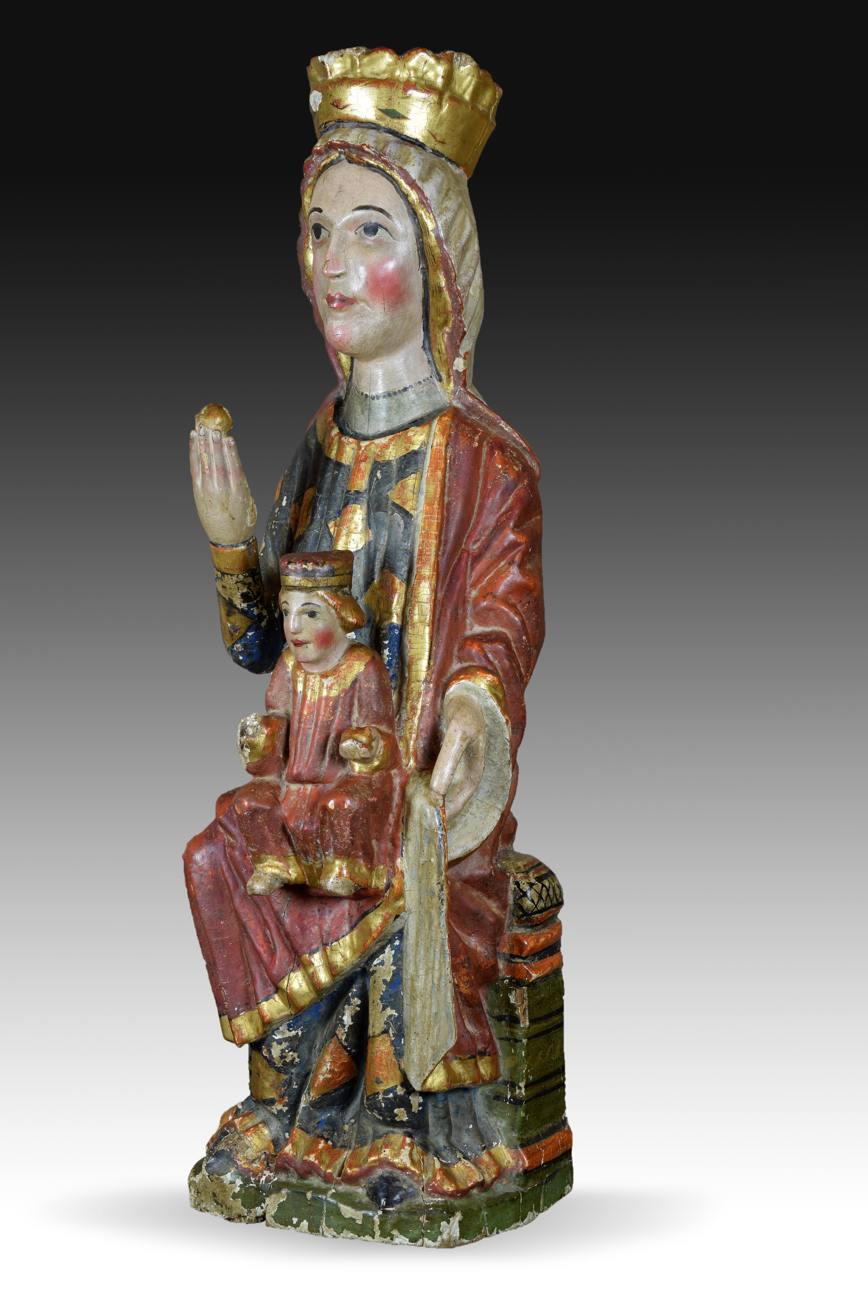 Virgin with Child. Carved and polychrome wood. Spanish school, 13th century.
 It has faults. 
Polychrome wood carving that shows the Virgin sitting on a throne, with her right hand raised holding a spherical object, dressed in a long tunic and